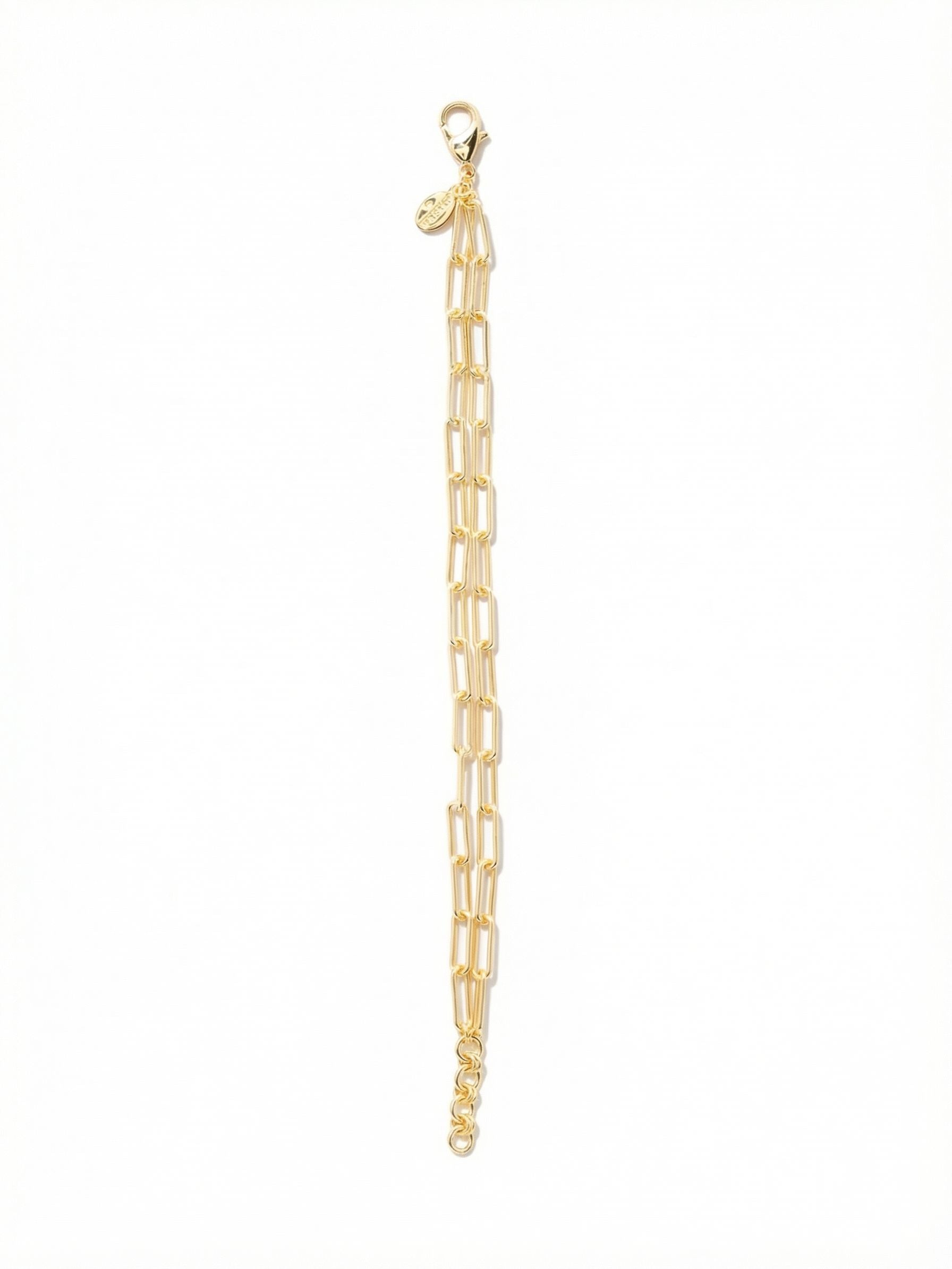 Rory Tennis Bracelet - 4BEV5BGMTL - <p>Two parallel strands of fine paperclip chain create a fluid, continuous loop of metallic texture. The elongated links catch the light quietly with every gesture you make. Built with a soft drape, this lightweight design offers the dimensional appeal of a layered look in a single piece. The adjustable length allows for a tailored fit that moves naturally through your day, serving as an effortless companion for heavier cuffs or a quiet accent entirely on its own.</p><ul>
<li>Dual strands of delicate paperclip chain for a built-in layered effect</li>
<li>Elongated open links offer fluid movement and a lightweight feel</li>
<li>Lobster claw clasp</li>
<li>3/4-inch adjustable extension chain</li>
<li>Protective e-coat finish for lasting wear</li>
<li>Includes signature organza pouch for gifting and travel</li>
</ul>