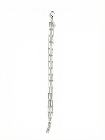 Rory Tennis Bracelet - 4BEV5PDMTL - <p>Two parallel rows of elongated paperclip links bring an architectural yet airy feel to your wrist stack. The bare metallic finish catches natural light from every angle, relying purely on the geometry of the double chain to make a quiet impression. It drapes lightly, moving with your natural rhythm throughout the day. An integrated extension chain allows you to tailor the drape, whether you prefer it worn close or gently slipping down your arm.</p><ul>
<li>Double parallel rows of elongated paperclip links</li>
<li>Pure metallic design with open geometric construction</li>
<li>Lobster claw clasp</li>
<li>3/4-inch adjustable extension chain</li>
<li>Protective e-coat finish for lasting wear</li>
<li>Includes signature organza pouch for gifting and travel</li>
</ul>
