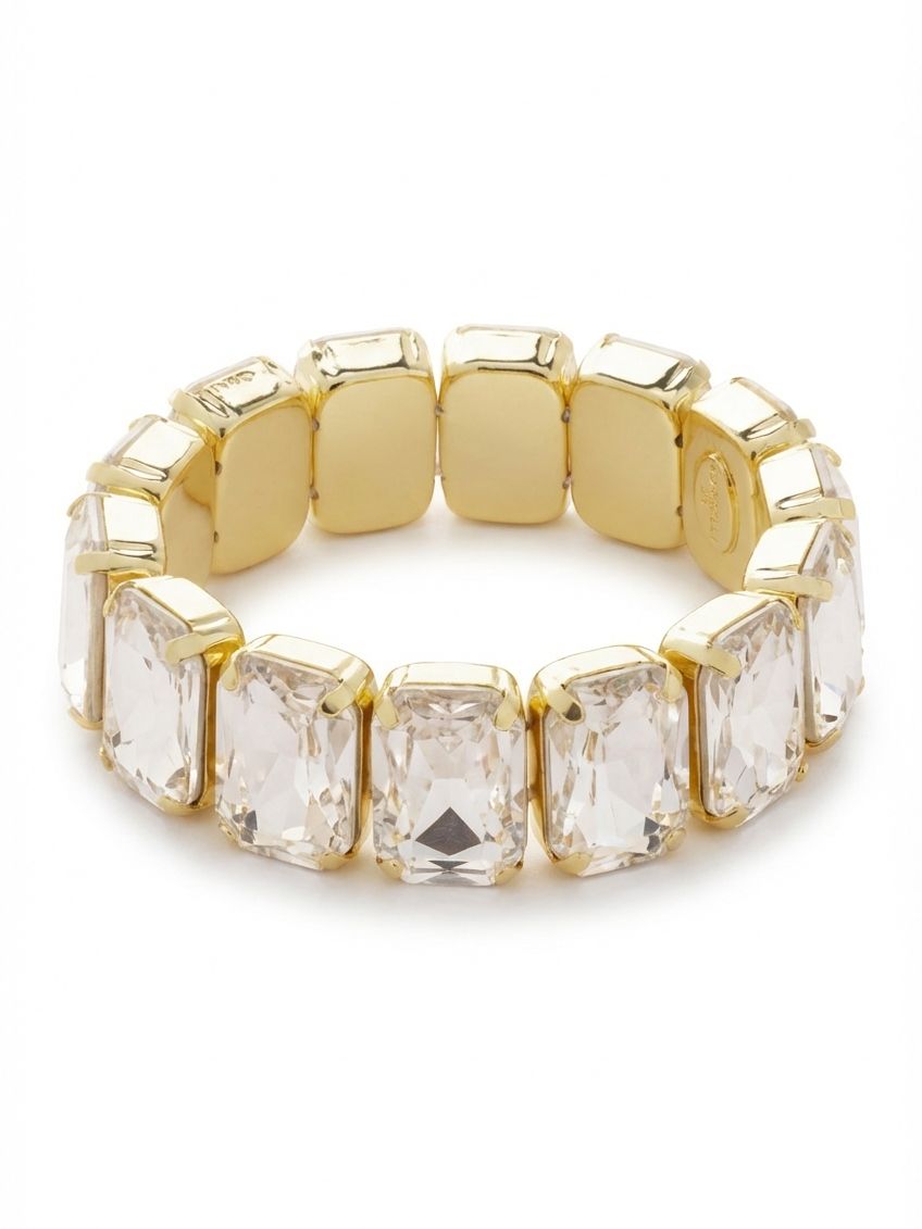 7 Inch Emerald Cut Stretch Bracelet - 4BFF70BGCRY - <p>Slip it on and let the light take over. Fourteen large emerald-cut crystals create an unbroken line of geometric architecture, held securely in bright gold-tone prongs. The step-cut facets catch the light in broad, linear flashes as your hand moves through the day. The stretch construction means there is no clasp to fumble with, offering immediate comfort that adapts to your movement. It easily holds its own as a solo statement, yet carries enough presence to anchor a heavily layered wrist.</p><ul>
<li>Unbroken line of oversized step-cut crystals</li>
<li>Bold geometric profile designed for easy stacking or solo wear</li>
<li>Stretch easy slip-on design</li>
<li>Protective e-coat finish for lasting wear</li>
<li>Includes signature organza pouch for gifting and travel</li>
</ul>