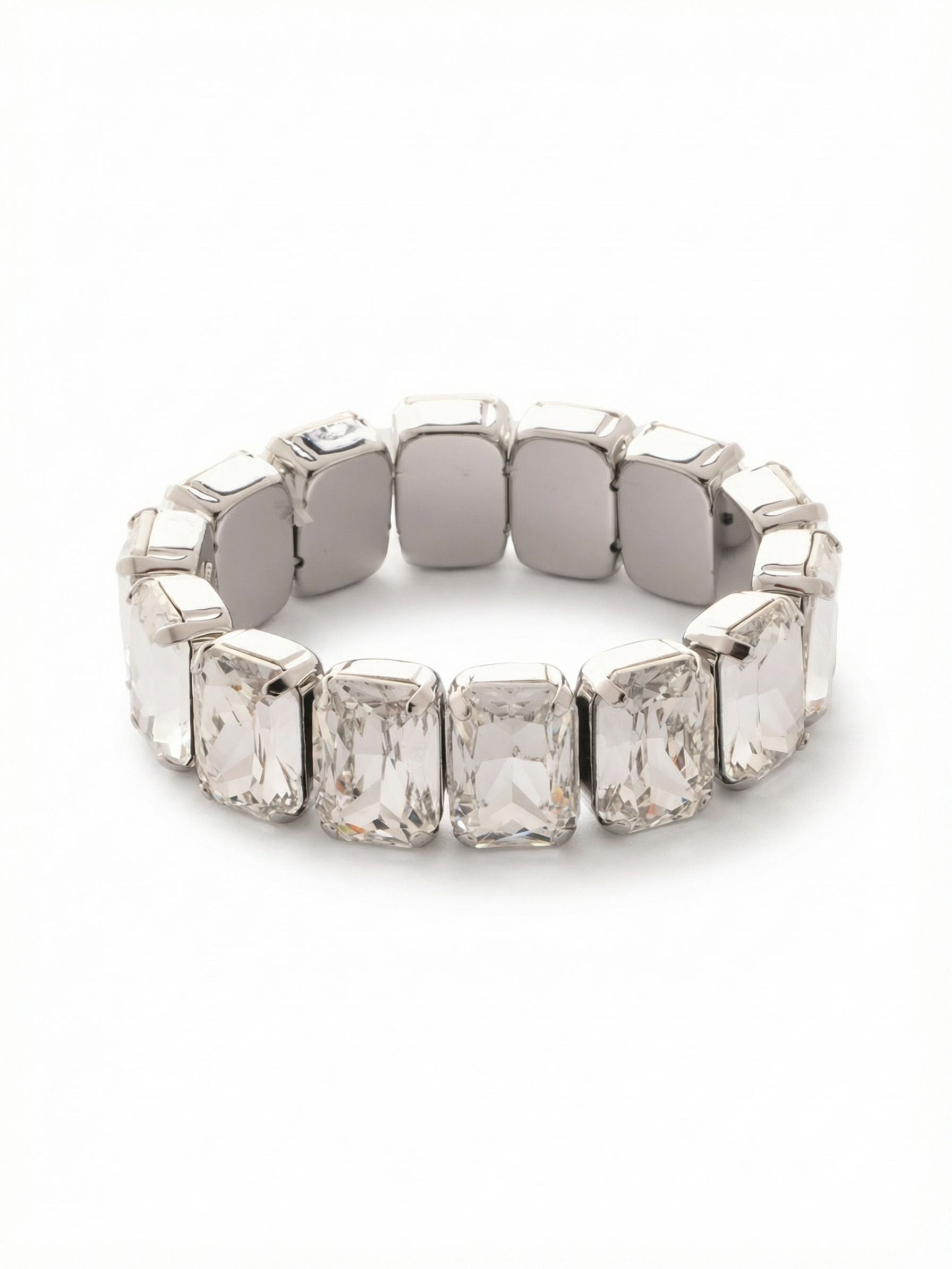 7 Inch Emerald Cut Stretch Bracelet - 4BFF70PDCRY - <p>A continuous circle of substantial clear crystals forms a bold, architectural line. The large emerald-cut stones offer elegant, step-cut flashes of light that feel both classic and completely modern. With a comfortable stretch design, there is no clasp to manage, allowing you to slide it easily over your hand. The crisp palladium setting provides a cool backdrop that lets the geometric shapes take center stage. Wear it alone for a strong statement, or use its repeating pattern to anchor a stack of thinner bangles.</p><ul>
<li>Continuous circle of large-scale emerald cuts</li>
<li>Step-cut facets create broad geometric flashes of light</li>
<li>Stretch easy slip-on design</li>
<li>Protective e-coat finish for lasting wear</li>
<li>Includes signature organza pouch for gifting and travel</li>
</ul>