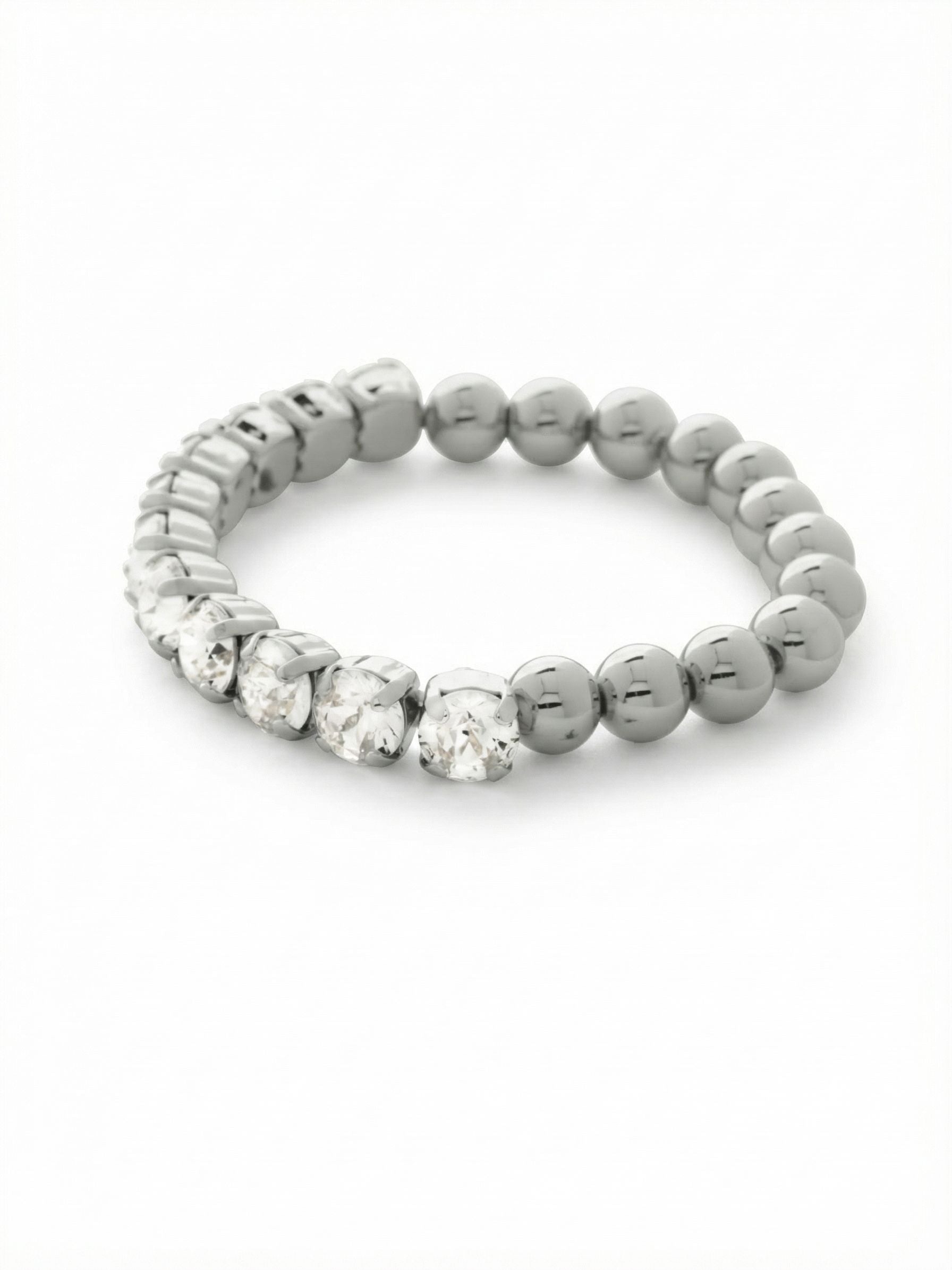 Crystal Zola Stretch Bracelet - 4BFJ40PDCRY - <p>A quiet study in contrast. Half of this stretch bracelet is anchored by sizable round-cut clear crystals that catch the light with every gesture. The other half transitions into smooth polished metallic beads, offering a tactile, grounding weight as you move. With a clasp-free design, it rolls easily over your hand, ready to anchor a larger stack or stand gracefully on its own during a busy day.</p><ul>
<li>Contrasting half-crystal and half-bead design</li>
<li>Clasp-free construction rolls easily over the hand</li>
<li>Stretch easy slip-on design</li>
<li>Protective e-coat finish for lasting wear</li>
<li>Includes signature organza pouch for gifting and travel</li>
</ul>