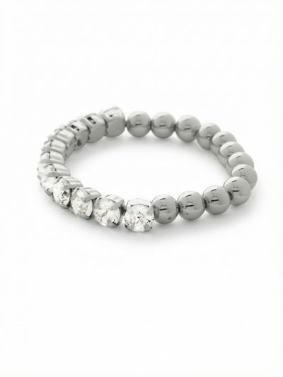 Crystal Zola Stretch Bracelet - 4BFJ40PDCRY - <p>A quiet study in contrast. Half of this stretch bracelet is anchored by sizable round-cut clear crystals that catch the light with every gesture. The other half transitions into smooth polished metallic beads, offering a tactile, grounding weight as you move. With a clasp-free design, it rolls easily over your hand, ready to anchor a larger stack or stand gracefully on its own during a busy day.</p><ul>
<li>Contrasting half-crystal and half-bead design</li>
<li>Clasp-free construction rolls easily over the hand</li>
<li>Stretch easy slip-on design</li>
<li>Protective e-coat finish for lasting wear</li>
<li>Includes signature organza pouch for gifting and travel</li>
</ul>
