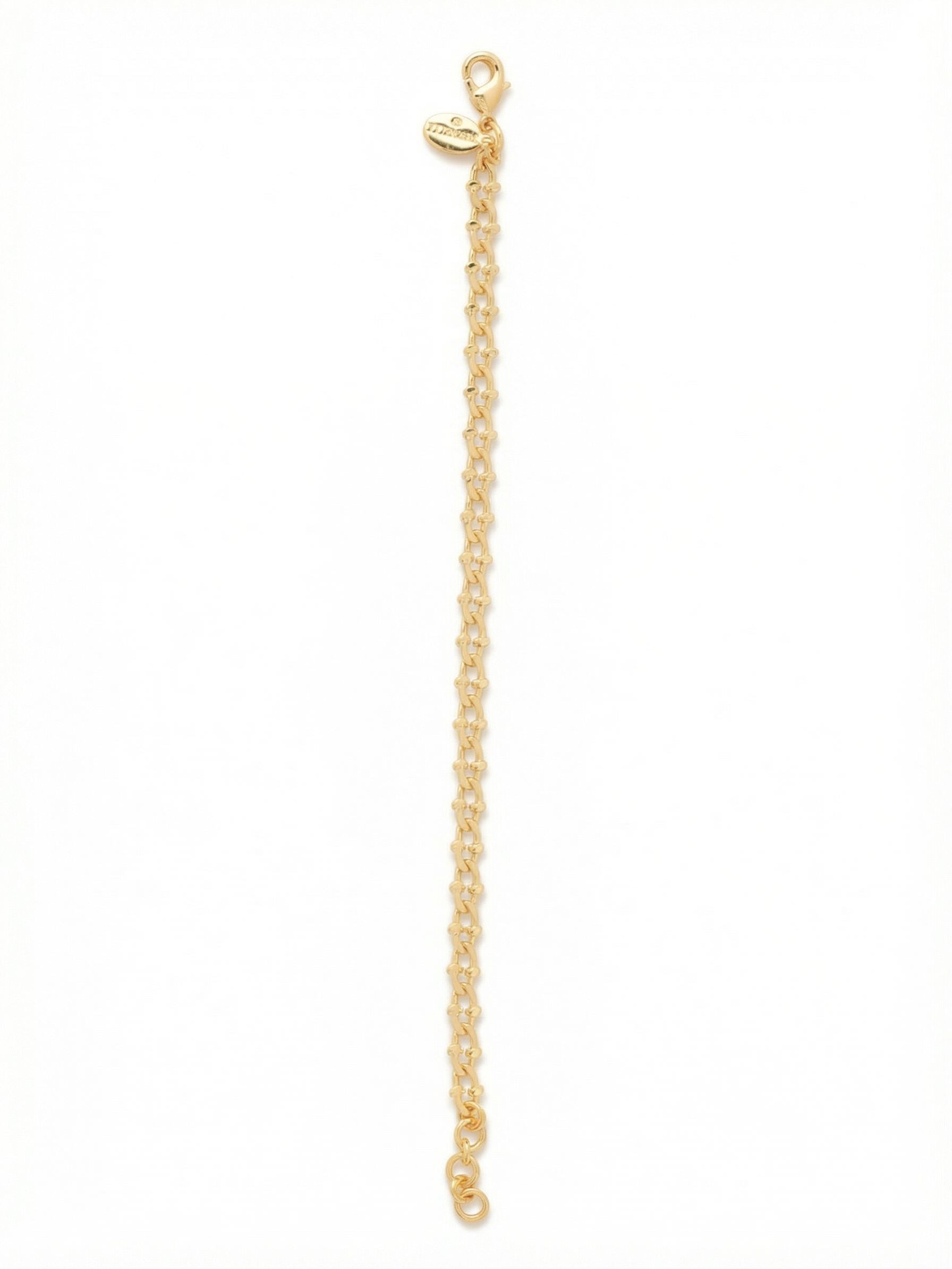 Crab Chain Tennis Bracelet - 4BGE1BGMTL - <p>An all-metal foundational piece that brings quiet texture to your daily stack. The articulated crab links move fluidly with your wrist, catching the light across their polished edges instead of relying on crystal. It holds its own when worn solo for a minimalist look and creates an excellent visual break between heavier stone bracelets. The attached extension chain allows you to tailor the drape for a secure, comfortable fit from morning to evening.</p><ul>
<li>Intricately textured metal links that catch the light without stones</li>
<li>Fluid articulated chain construction built for seamless layering</li>
<li>Lobster claw clasp</li>
<li>3/4-inch adjustable extension chain</li>
<li>Protective e-coat finish for lasting wear</li>
<li>Includes signature organza pouch for gifting and travel</li>
</ul>