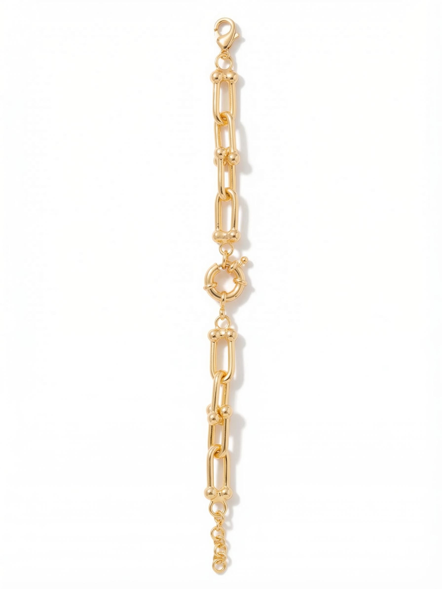Tinley Tennis Bracelet - 4BGI1BGMTL - <p>Elongated, polished metal U-links articulate freely to give this chain-style bracelet a fluid movement throughout your day. Rounded nodes connect each link, adding structural weight and tactile interest while keeping the overall profile clean. An oversized central ring anchors the design, breaking up the continuous line with architectural detail. Substantial enough to anchor a layered stack but perfectly balanced to wear alone, it includes an extension chain so you can adjust the drape exactly to your preference.</p><ul>
<li>Elongated chain links connected by rounded metallic nodes</li>
<li>Oversized architectural center ring detail</li>
<li>Lobster claw clasp with secure safety chain</li>
<li>3/4-inch adjustable extension chain</li>
<li>Protective e-coat finish for lasting wear</li>
<li>Includes signature organza pouch for gifting and travel</li>
</ul>