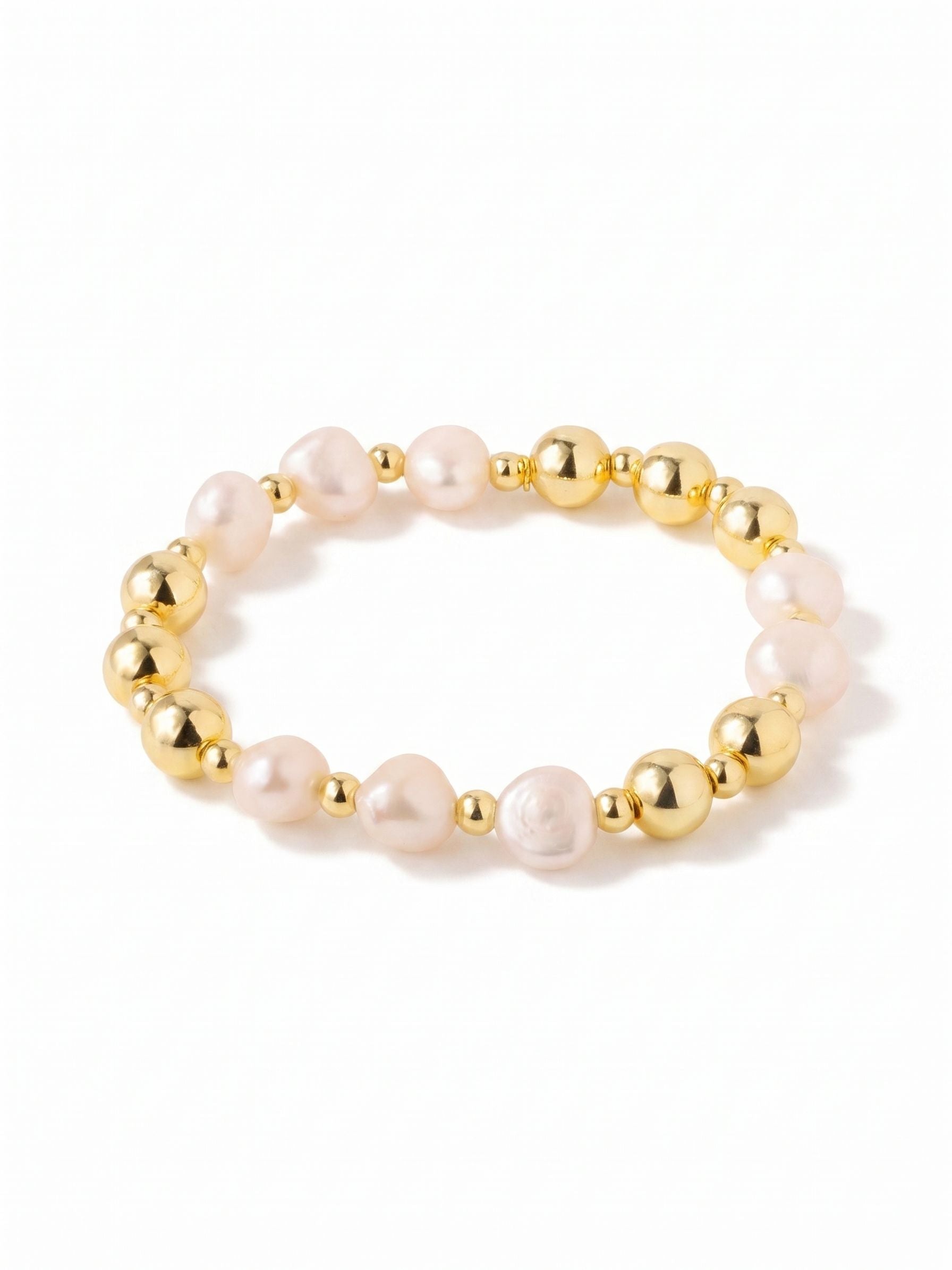 Pearl & Bead Stretch Bracelet - 4BGK6BGMDP - <p>Eight substantial white baroque pearls circle the wrist with an organic, uneven texture. The stretch design slips easily over your hand, adapting instantly to your movements for comfortable, clasp-free wear. Because each pearl holds a naturally irregular shape, they catch the light uniquely as you move, bringing a relaxed warmth to your daily routine. Subtle bright gold tones accent the classic white stones, creating an effortless, grounded piece you will find yourself reaching for on repeat.</p><ul>
<li>Irregular baroque pearls bring organic texture to a classic silhouette</li>
<li>Substantial 10mm scale provides a grounded visual weight</li>
<li>Stretch easy slip-on design</li>
<li>Protective e-coat finish for lasting wear</li>
<li>Includes signature organza pouch for gifting and travel</li>
</ul>