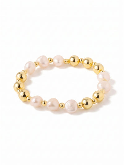 Pearl & Bead Stretch Bracelet - 4BGK6BGMDP - <p>Eight substantial white baroque pearls circle the wrist with an organic, uneven texture. The stretch design slips easily over your hand, adapting instantly to your movements for comfortable, clasp-free wear. Because each pearl holds a naturally irregular shape, they catch the light uniquely as you move, bringing a relaxed warmth to your daily routine. Subtle bright gold tones accent the classic white stones, creating an effortless, grounded piece you will find yourself reaching for on repeat.</p><ul>
<li>Irregular baroque pearls bring organic texture to a classic silhouette</li>
<li>Substantial 10mm scale provides a grounded visual weight</li>
<li>Stretch easy slip-on design</li>
<li>Protective e-coat finish for lasting wear</li>
<li>Includes signature organza pouch for gifting and travel</li>
</ul>