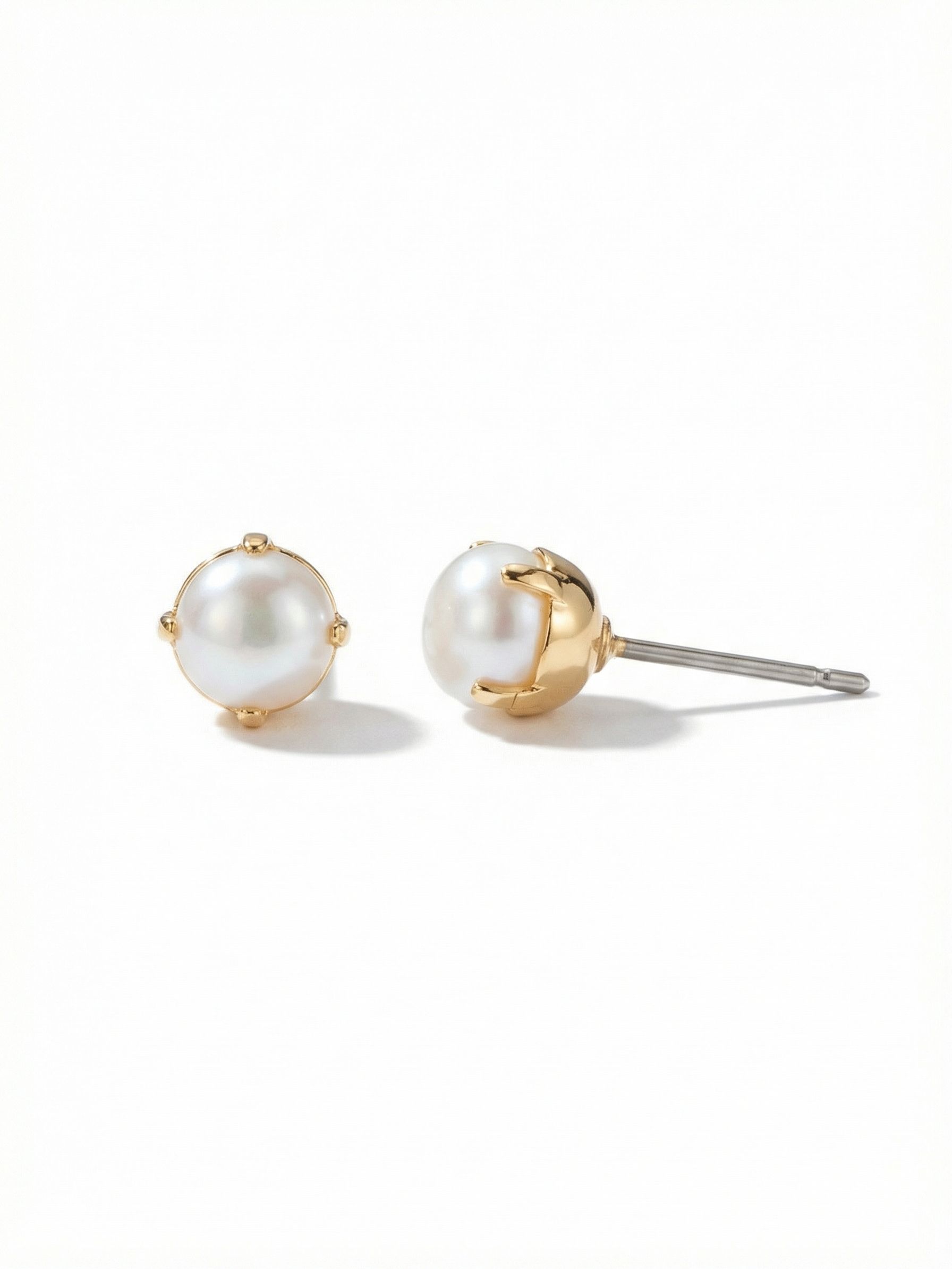 Langley Stud Earring - 4EET7BGMDP - <p>A single white pearl sits close to the earlobe in a bright gold-tone, four-prong setting. The soft luster of the baroque pearl brings a quiet polish to your daily routine, catching light gently as you move. A pressure-fit comfort back holds the post securely in place, keeping this classic stud comfortable from morning coffee to evening errands.</p><ul>
<li>Pronounced four-prong setting creates a distinct metallic border</li>
<li>Post with oversized comfort-clutch back</li>
<li>Protective e-coat finish for lasting wear</li>
<li>Includes signature organza pouch for gifting and travel</li>
</ul>