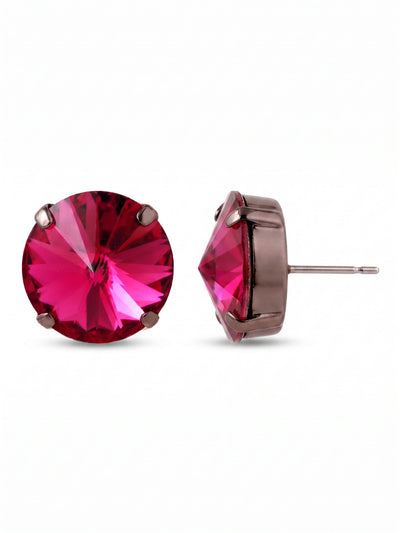 Nadine Stud Earrings - 4EEZ17GMFU - <p>A single, substantial round crystal anchors this design, bringing an intense flash of fuchsia to your daily rotation. The deep cut of the stone catches the light from across a room, while the dark gunmetal setting grounds the bright color with quiet contrast. Measuring just over half an inch, this piece offers significant visual presence. To ensure this larger profile sits perfectly all day, we include an oversized comfort clutch that holds the post securely in place.</p><ul>
<li>Substantial singular round crystal design</li>
<li>Deeply faceted cut for intense light reflection</li>
<li>Post with oversized comfort-clutch back</li>
<li>Includes signature organza pouch for gifting and travel</li>
</ul>