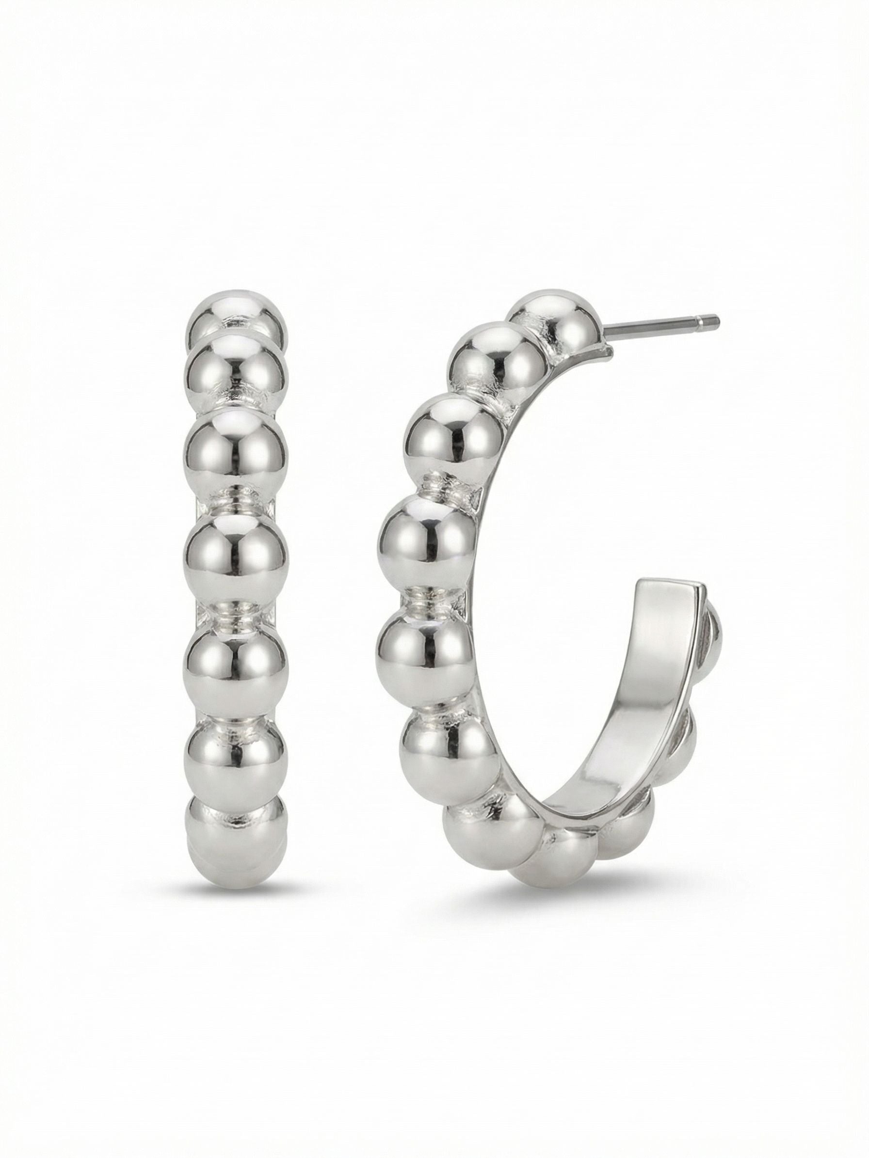 Bauble Hoop Earrings - 4EFL12PDMTL - <p>These are not your standard hoops. A continuous row of smooth metal spheres catches the light with a quiet rhythm, creating a highly tactile update to an everyday silhouette. The interior of the curve remains flat, allowing the earring to feel substantial without unnecessary bulk. Sized just under an inch, they offer noticeable presence while the oversized comfort clutch keeps them sitting perfectly upright from morning coffee to evening plans.</p><ul>
<li>Continuous row of smooth metal spheres creates a highly tactile texture</li>
<li>Flat interior band reduces overall weight for comfortable daily wear</li>
<li>Post with oversized comfort-clutch back</li>
<li>Protective e-coat finish for lasting wear</li>
<li>Includes signature organza pouch for gifting and travel</li>
</ul>