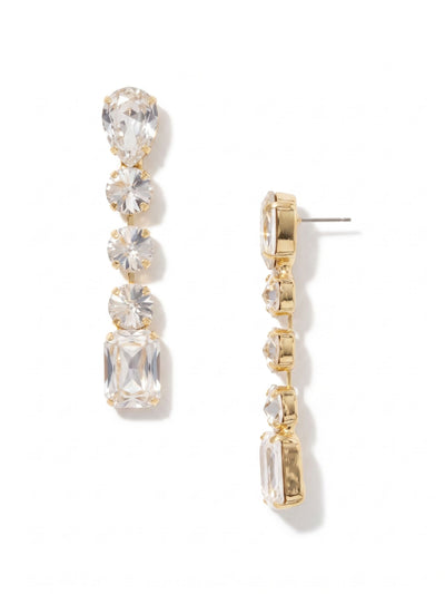 Lucille Statement Earrings - 4EFL3BGCRY - <p>Introducing our exquisite Lucille Statement Earrings! These stunning earrings boast a captivating pear-cut crystal, delicately set on a chic post. Dangling gracefully from the central crystal are three mesmerizing round-cut crystals, creating a harmonious dance of light with every movement. And as the pièce de résistance, a mesmerizing emerald-cut crystal elegantly graces the bottom, adding an extra touch of sophistication. From Sorrelli's Crystal collection in our Bright Gold-tone finish.</p>
