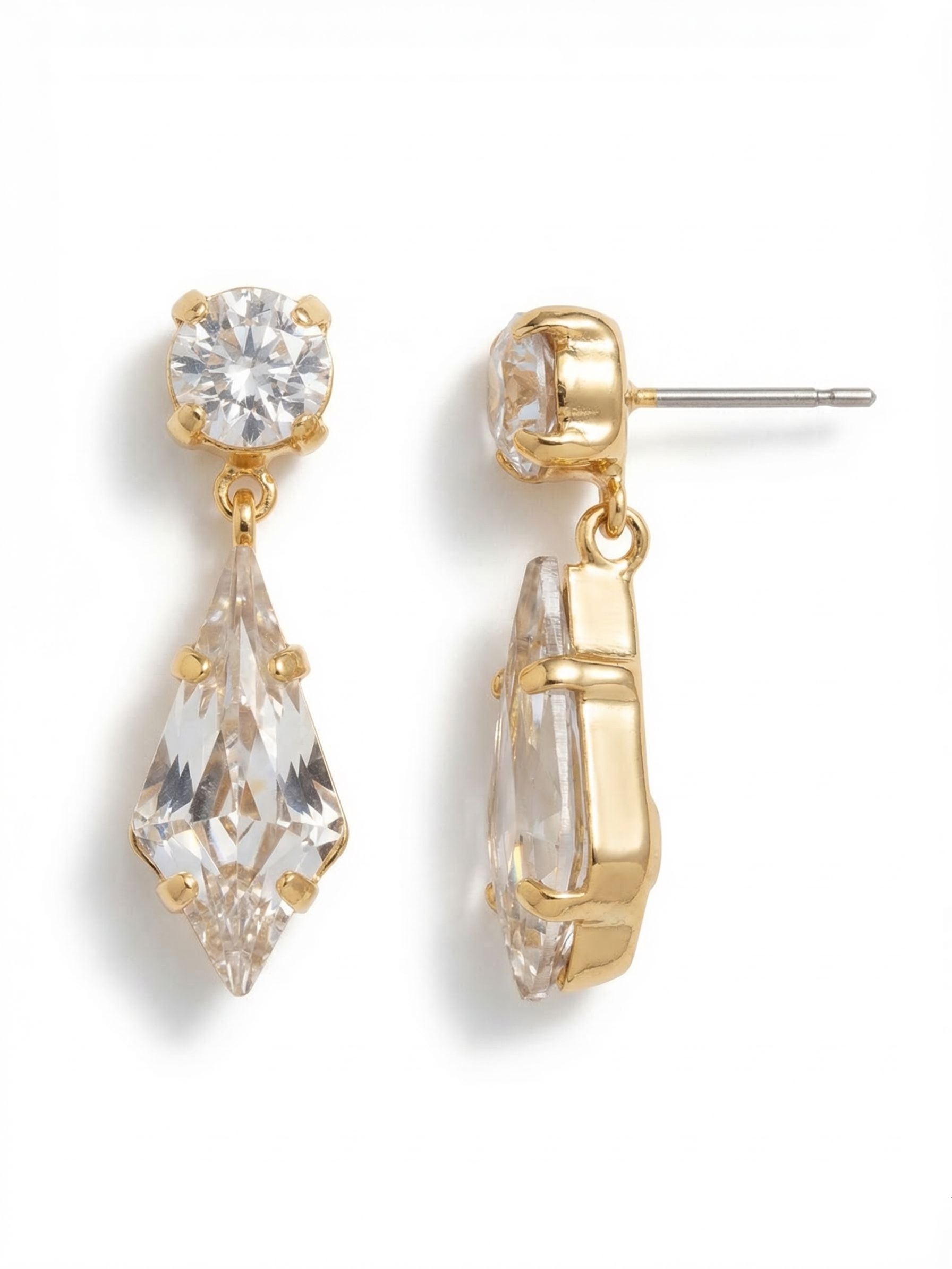 Colette Dangle Earrings - 4EFZ5BGCRY - <p>A single round crystal rests directly on the ear, anchoring an articulated kite-shaped drop that sways with your natural movement. At just an inch long, they create a steady rhythm of reflection that reads clearly from across a table without feeling heavy. We include an oversized comfort clutch back to keep the stones perfectly balanced and secure all day, ensuring the clean lines stay exactly where you want them.</p><ul>
<li>Contrasting geometry between the round post and elongated kite-shaped drop</li>
<li>Articulated joint allows the lower stone to catch light with natural movement</li>
<li>Post with oversized comfort-clutch back</li>
<li>Protective e-coat finish for lasting wear</li>
<li>Includes signature organza pouch for gifting and travel</li>
</ul>