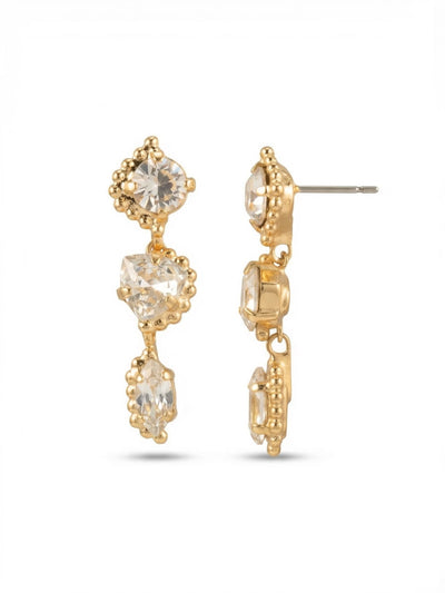 Rene Dangle Earrings - 4EGI1BGCRY - <p>Three distinct crystal cuts stack in a refined descent, moving from a classic round post down to an articulated trillion and finishing with a slender marquise. Each stone is framed by detailed beaded metalwork that adds subtle texture to the profile. The flexible links give the drop a gentle, responsive sway as you walk. We include an oversized comfort back to keep this linear silhouette secure and perfectly upright all day.</p><ul>
<li>Three varied crystal cuts in a single linear sequence</li>
<li>Detailed beaded metalwork frames each individual setting</li>
<li>Post with oversized comfort-clutch back</li>
<li>Protective e-coat finish for lasting wear</li>
<li>Includes signature organza pouch for gifting and travel</li>
</ul>