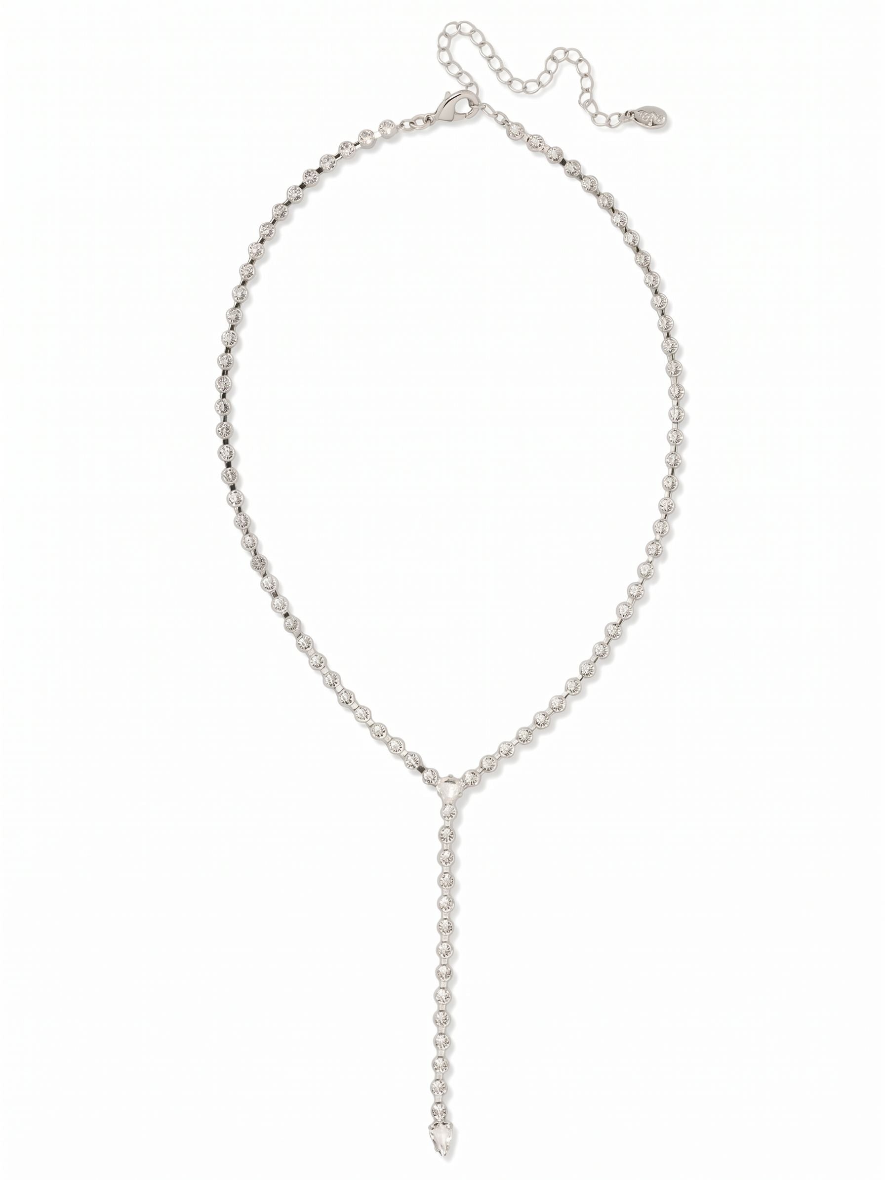 Lena Lariat Long Necklace - 4NFC14PDCRY - <p>A fluid line of continuous crystals meets at a sharp trillion-cut junction before releasing into a weighted pear-cut drop. This lariat traces a lengthening path down the collar, catching light with every subtle shift in posture. The flexible rhinestone chain drapes easily, settling right where you need it with an adjustable extension. It reads as a quiet focal point layered over silk or an open button-down, anchoring your neckline with clean geometry and deliberate movement.</p><ul>
<li>Continuous rhinestone chain construction for fluid drape and movement</li>
<li>Trillion and pear-cut focal points anchor the linear drop</li>
<li>Lobster claw clasp</li>
<li>4-inch adjustable extension chain</li>
<li>Protective e-coat finish for lasting wear</li>
<li>Includes signature organza pouch for gifting and travel</li>
</ul>