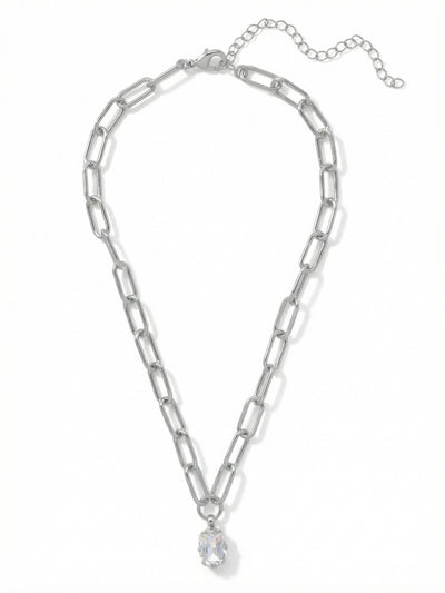 Nia Oval Pendant Necklace - 4NFJ18PDCRY - <p>A single emerald-cut crystal drops from a substantial paperclip chain. The geometric links add a quiet modern edge to the traditional solitaire pendant. It drapes naturally near the collarbone, catching the light as you move through your day. An included extension chain allows you to adjust the drop, making it an easy piece to layer with finer strands or wear alone against a bare neckline.</p><ul>
<li>Modern paperclip chain construction adds geometric texture</li>
<li>A single emerald-cut crystal anchors the piece</li>
<li>Lobster claw clasp</li>
<li>4-inch adjustable extension chain</li>
<li>Protective e-coat finish for lasting wear</li>
<li>Includes signature organza pouch for gifting and travel</li>
</ul>