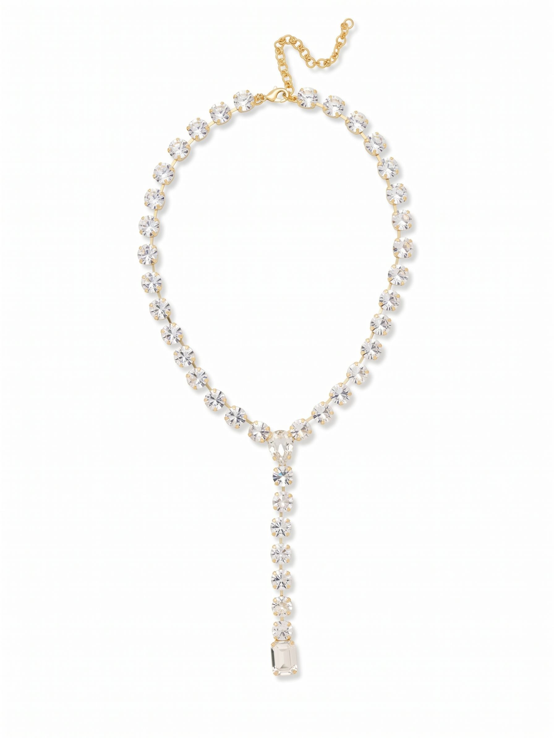 Lucille Lariat Statement Necklace - 4NFL3BGCRY - <p>A substantial line of large round crystals forms a fluid collar that drops into a sharp lariat silhouette. The satisfying weight of the crystal-set chain grounds the necklace, keeping the central Y-shape perfectly aligned as you move through your evening. A pear-cut crystal anchors the junction, drawing the eye downward to a final, heavy emerald-cut drop. It offers a confident drape that fills deep necklines or provides crisp contrast over high-collared silks. An integrated extension chain allows you to tailor the plunge exactly where you want it.</p><ul>
<li>Fluid kette chain construction set with continuous round crystals</li>
<li>Anchored by alternating pear and emerald-cut crystal focal points</li>
<li>Lobster claw clasp</li>
<li>4-inch adjustable extension chain</li>
<li>Protective e-coat finish for lasting wear</li>
<li>Includes signature organza pouch for gifting and travel</li>
</ul>