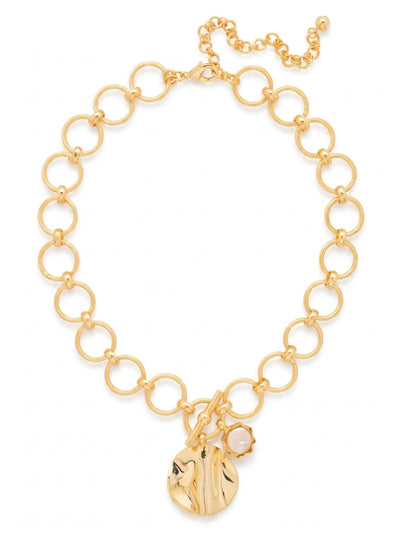 Guinevere Pearl Pendant Necklace - 4NFZ6BGMDP - <p>Heavy textured rings link together to form a substantial chain that rests confidently near the collarbone. A decorative front toggle anchors two distinctive drops. A large, undulating gold disc catches ambient light with your movement, accompanied by a single coin pearl in a scalloped bezel. The weight of the roped links feels grounding yet comfortable, while an extension chain allows you to fine-tune the drape. This design effortlessly anchors a crisp button-down or adds sculptural interest to an open neckline.</p><ul>
<li>Substantial collar formed by interlocking textured rings</li>
<li>Contrasting drop pendants of hammered metal and white pearl</li>
<li>Lobster claw clasp</li>
<li>4-inch adjustable extension chain</li>
<li>Protective e-coat finish for lasting wear</li>
<li>Includes signature organza pouch for gifting and travel</li>
</ul>