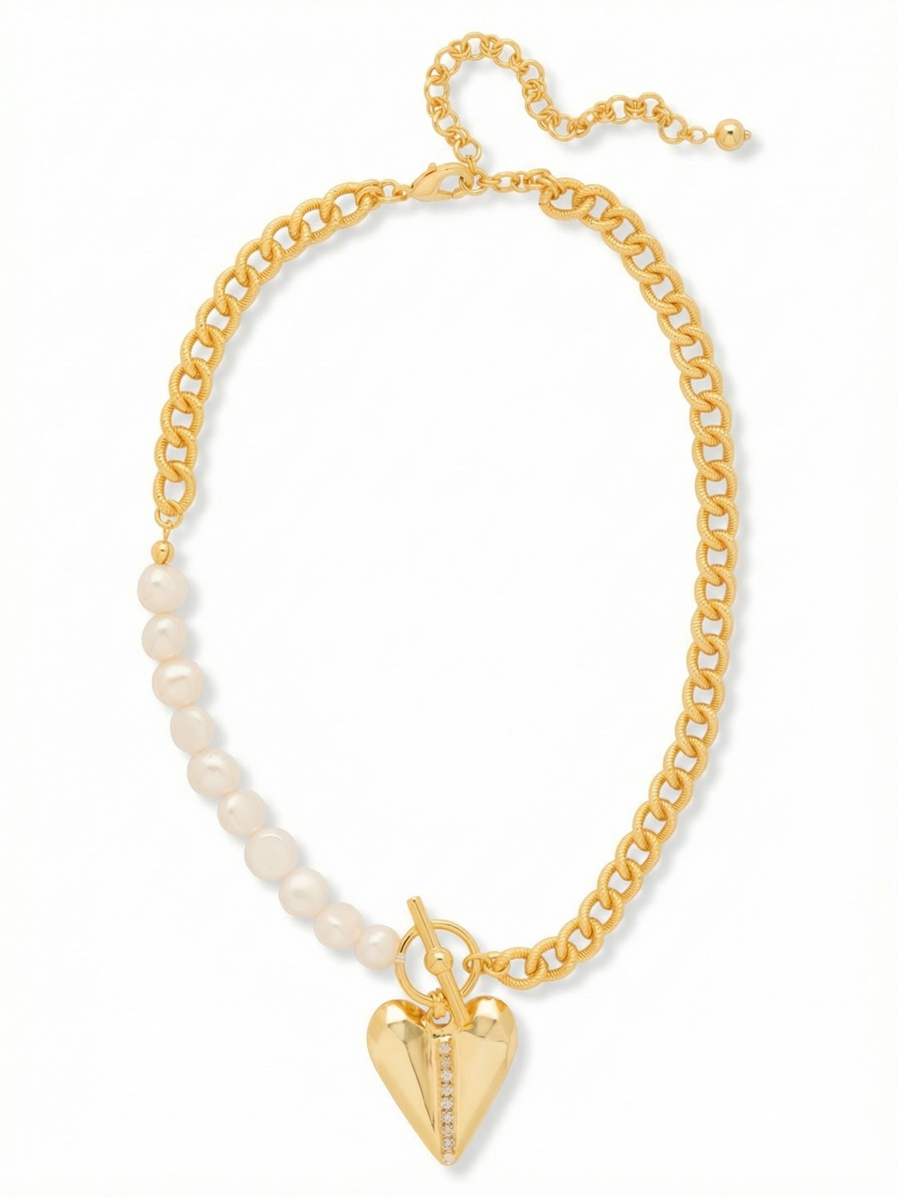 Lulu Pendant Necklace - 4NGB5BGMDP - <p>An asymmetrical take on a classic silhouette pairs the substantial weight of a curb chain with the quiet luster of white baroque pearls. At the center rests a faceted metal heart pendant cleanly bisected by a delicate row of inset crystals. The mixed-texture design balances tailored polish with a grounding, solid feel. An included extension chain allows you to adjust the drape to hit perfectly below the collarbone, making it an easy anchor piece to wear alone or layer effortlessly under a collared shirt.</p><ul>
<li>Asymmetrical design mixing classic curb chain with smooth baroque pearls</li>
<li>Weighty faceted heart pendant accented with a vertical crystal channel</li>
<li>Lobster claw clasp</li>
<li>4-inch adjustable extension chain</li>
<li>Protective e-coat finish for lasting wear</li>
<li>Includes signature organza pouch for gifting and travel</li>
</ul>