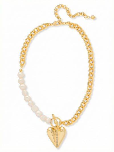 Lulu Pendant Necklace - 4NGB5BGMDP - <p>An asymmetrical take on a classic silhouette pairs the substantial weight of a curb chain with the quiet luster of white baroque pearls. At the center rests a faceted metal heart pendant cleanly bisected by a delicate row of inset crystals. The mixed-texture design balances tailored polish with a grounding, solid feel. An included extension chain allows you to adjust the drape to hit perfectly below the collarbone, making it an easy anchor piece to wear alone or layer effortlessly under a collared shirt.</p><ul>
<li>Asymmetrical design mixing classic curb chain with smooth baroque pearls</li>
<li>Weighty faceted heart pendant accented with a vertical crystal channel</li>
<li>Lobster claw clasp</li>
<li>4-inch adjustable extension chain</li>
<li>Protective e-coat finish for lasting wear</li>
<li>Includes signature organza pouch for gifting and travel</li>
</ul>