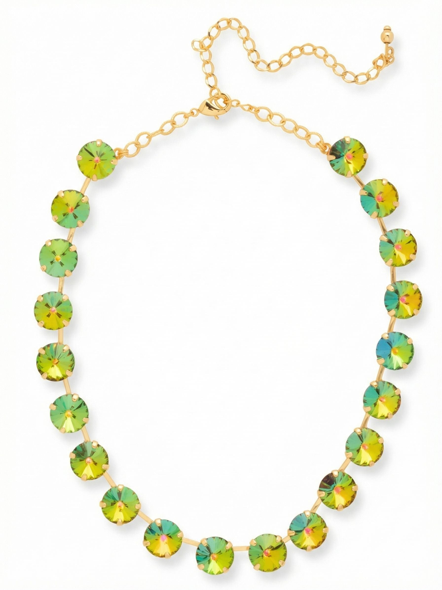 Mara Choker Tennis Necklace - 4NGB6BGVO - <p>Twenty oversized round crystals space themselves deliberately across the collarbone. Because the stones are connected by short metal bars rather than linked tightly together, each crystal has room to capture light independently. This open construction allows the shifting green and pink tones of the volcano glass to take focus while keeping the overall piece feeling light in motion. The baseline choker length frames an open neckline beautifully, while the extension chain lets you control exactly where the line of color rests.</p><ul>
<li>Oversized round crystals separated by open bar links</li>
<li>Iridescent glass shifts between green and pink tones in the light</li>
<li>Lobster claw clasp</li>
<li>4-inch adjustable extension chain</li>
<li>Protective e-coat finish for lasting wear</li>
<li>Includes signature organza pouch for gifting and travel</li>
</ul>