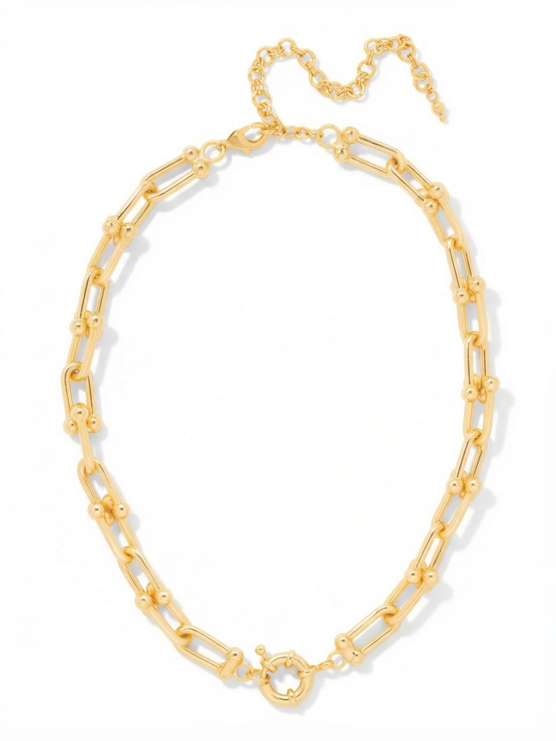 Tinley Tennis Necklace - 4NGI1BGMTL - <p>A bold take on the classic chain. Elongated open U-links built with small rounded accents give this all-metal necklace a distinct, architectural presence. The substantial weight ensures a clean drape along the collarbone, anchoring your neckline whether worn solo or layered heavily with finer strands. An included extension chain allows you to tailor the drop precisely, creating a customized fit for your frame.</p><ul>
<li>Elongated open hardware links with small spherical accents</li>
<li>Substantial metal construction provides a clean collarbone drape</li>
<li>Lobster claw clasp with secure safety chain</li>
<li>4-inch adjustable extension chain</li>
<li>Protective e-coat finish for lasting wear</li>
<li>Includes signature organza pouch for gifting and travel</li>
</ul>