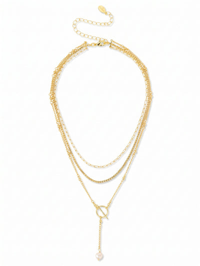 Bela Layered Necklace - 4NGK1BGMDP - <p>A single white baroque pearl brings an organic softness to the bright gold finish of this pendant. Resting near the collarbone, the pearl is suspended on an interplay of classic cable and structured box chains that catch the light differently as you move. The short length sits high on the neckline, while the included extension chain lets you adjust the drop to suit your layers. It brings a quiet polish to whatever you happen to be wearing.</p><ul>
<li>Single baroque pearl focal point with an organic shape</li>
<li>Contrasting mix of structured box and classic cable chains</li>
<li>Lobster claw clasp</li>
<li>4-inch adjustable extension chain</li>
<li>Protective e-coat finish for lasting wear</li>
<li>Includes signature organza pouch for gifting and travel</li>
</ul>