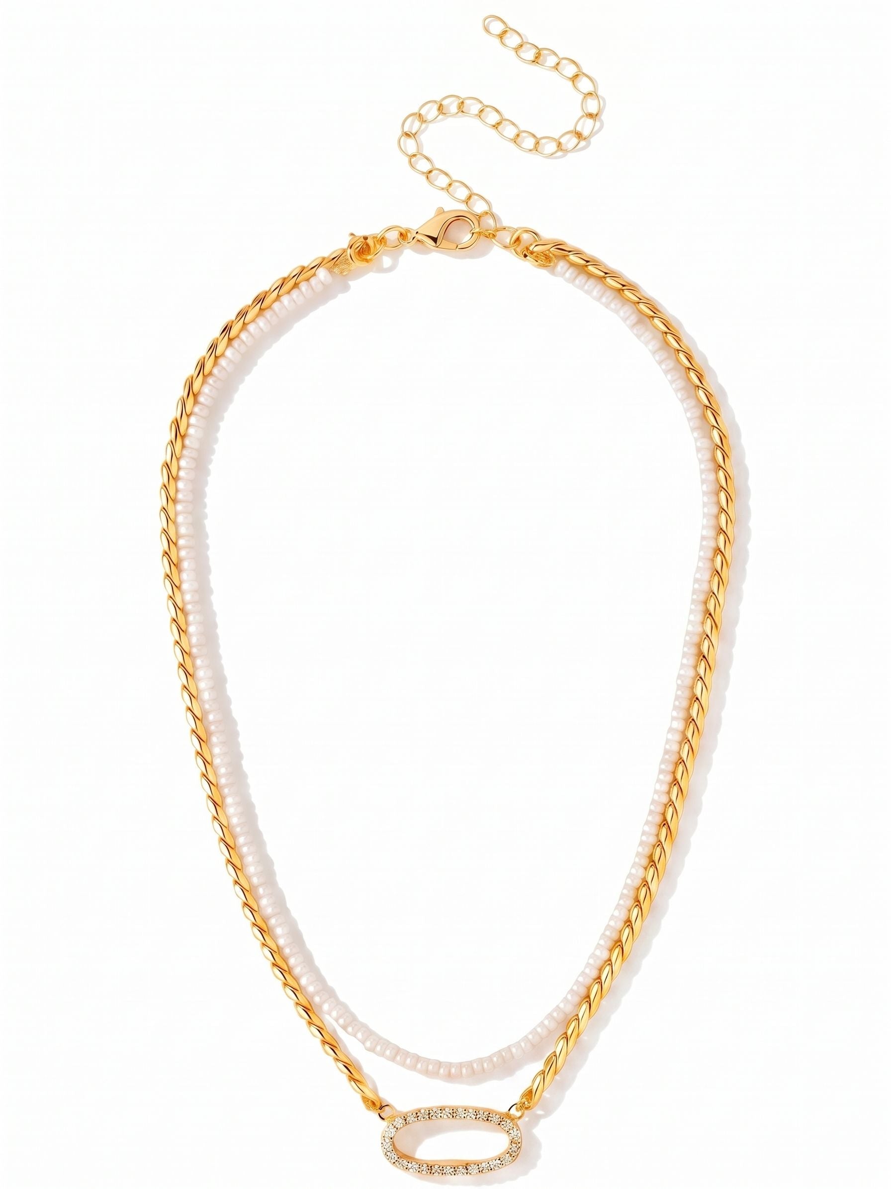 Percy Tennis Necklace - 4NGK3BGCRY - <p>Two strands combine in a single piece to create a truly customizable look. A removeable row of pearl beads rests softly along the collarbone, paired with a thicker twisted rope chain that drops just below. This lower chain anchors an open oval pendant outlined in bright crystals. An included extension chain lets you adjust the drape, making it easy to tailor the fit to different necklines. It brings immediate texture and warmth to an open collar or simple sweater.</p><ul>
<li>Customizable design pairs a removeable pearl strand with a twisted rope chain</li>
<li>Open oval focal point lined with small crystals catches light at the neckline</li>
<li>Lobster claw clasp with secure safety chain</li>
<li>4-inch adjustable extension chain</li>
<li>Protective e-coat finish for lasting wear</li>
<li>Includes organza pouch for gifting and travel</li>
</ul>