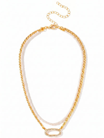 Percy Tennis Necklace - 4NGK3BGCRY - <p>Two strands combine in a single piece to create a truly customizable look. A removeable row of pearl beads rests softly along the collarbone, paired with a thicker twisted rope chain that drops just below. This lower chain anchors an open oval pendant outlined in bright crystals. An included extension chain lets you adjust the drape, making it easy to tailor the fit to different necklines. It brings immediate texture and warmth to an open collar or simple sweater.</p><ul>
<li>Customizable design pairs a removeable pearl strand with a twisted rope chain</li>
<li>Open oval focal point lined with small crystals catches light at the neckline</li>
<li>Lobster claw clasp with secure safety chain</li>
<li>4-inch adjustable extension chain</li>
<li>Protective e-coat finish for lasting wear</li>
<li>Includes organza pouch for gifting and travel</li>
</ul>