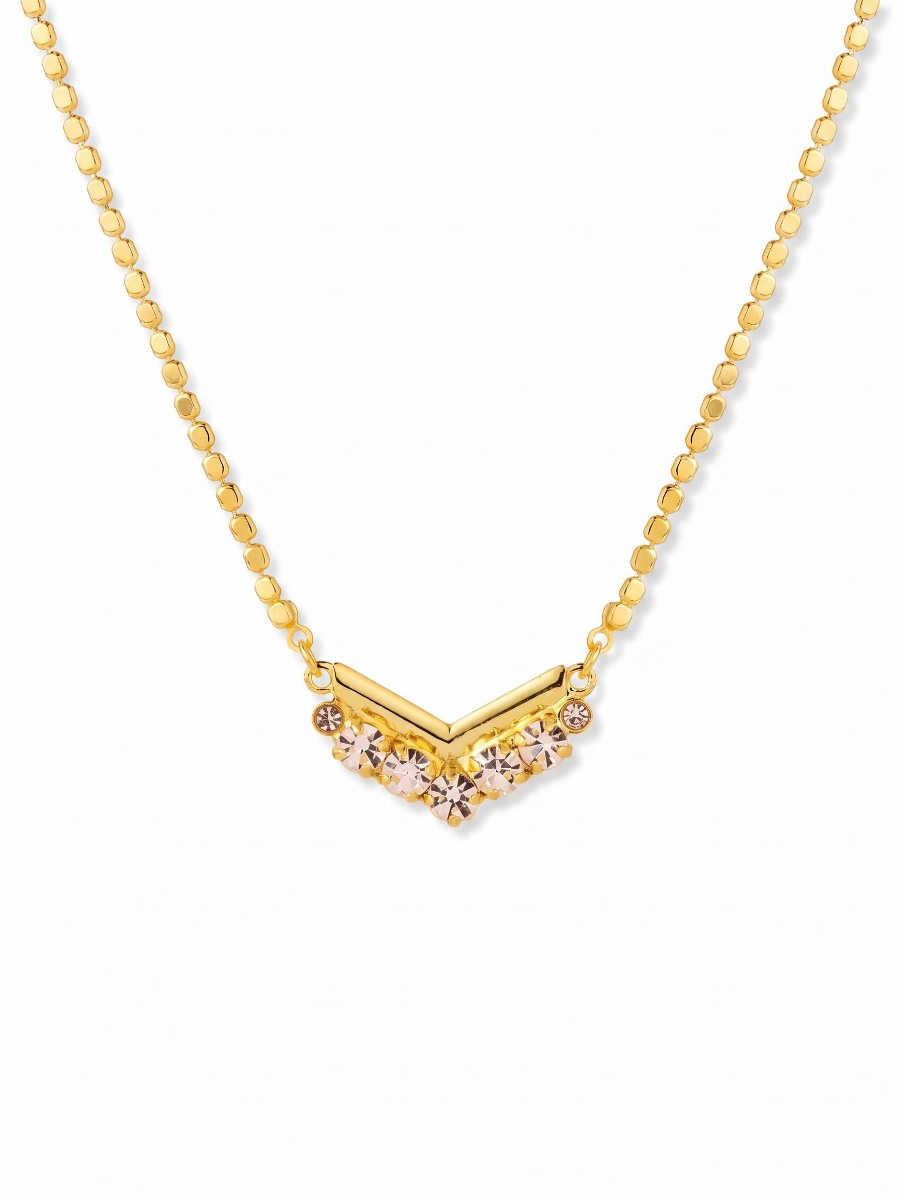 Mika Pendant Necklace - 4NGK5BGCRY - <p>The tactile weight of a bright gold-tone ball chain anchors a delicate arrangement of faceted clear crystals at your collarbone. Seven distinct stones in varying round cuts catch the light with every subtle movement, adding a quiet gleam to a simple sweater or an open neckline. A built-in extension chain lets you adjust the drop, making it an easy piece to layer with your daily staples or wear alone as an understated focal point.</p><ul>
<li>Cluster of varied round crystals creates a delicate focal point</li>
<li>Tactile ball chain offers an understated contrast to the faceted stones</li>
<li>Lobster claw clasp</li>
<li>4-inch adjustable extension chain</li>
<li>Protective e-coat finish for lasting wear</li>
<li>Includes signature organza pouch for gifting and travel</li>
</ul>