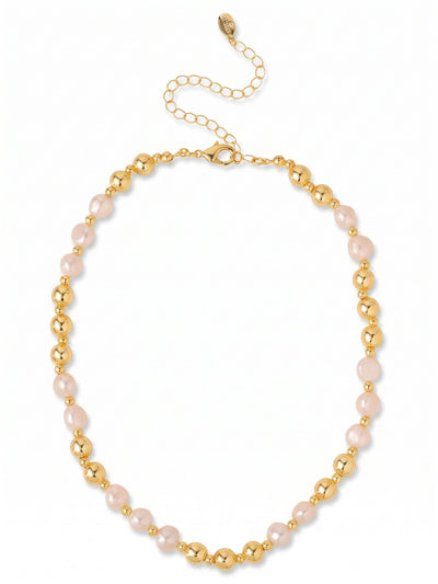 Pearl & Bead Tennis Necklace - 4NGK6BGMDP - <p>Fifteen baroque pearls rest along the collarbone, their organic shapes offering a fresh perspective on a traditional strand. Small faceted crystals anchor the pearls, catching the light as you move and breaking up the line with subtle flashes. The bright gold tone warms the white pearls, creating a balanced contrast against your skin. An extension chain lets you adjust the drape to work with different necklines or seamlessly layer with other pieces in your jewelry box.</p><ul>
<li>Alternating rhythm of organic baroque pearls and delicate faceted accent crystals</li>
<li>Substantial pearl shape provides natural texture and an asymmetrical profile</li>
<li>Lobster claw clasp</li>
<li>4-inch adjustable extension chain</li>
<li>Protective e-coat finish for lasting wear</li>
<li>Includes signature organza pouch for gifting and travel</li>
</ul>