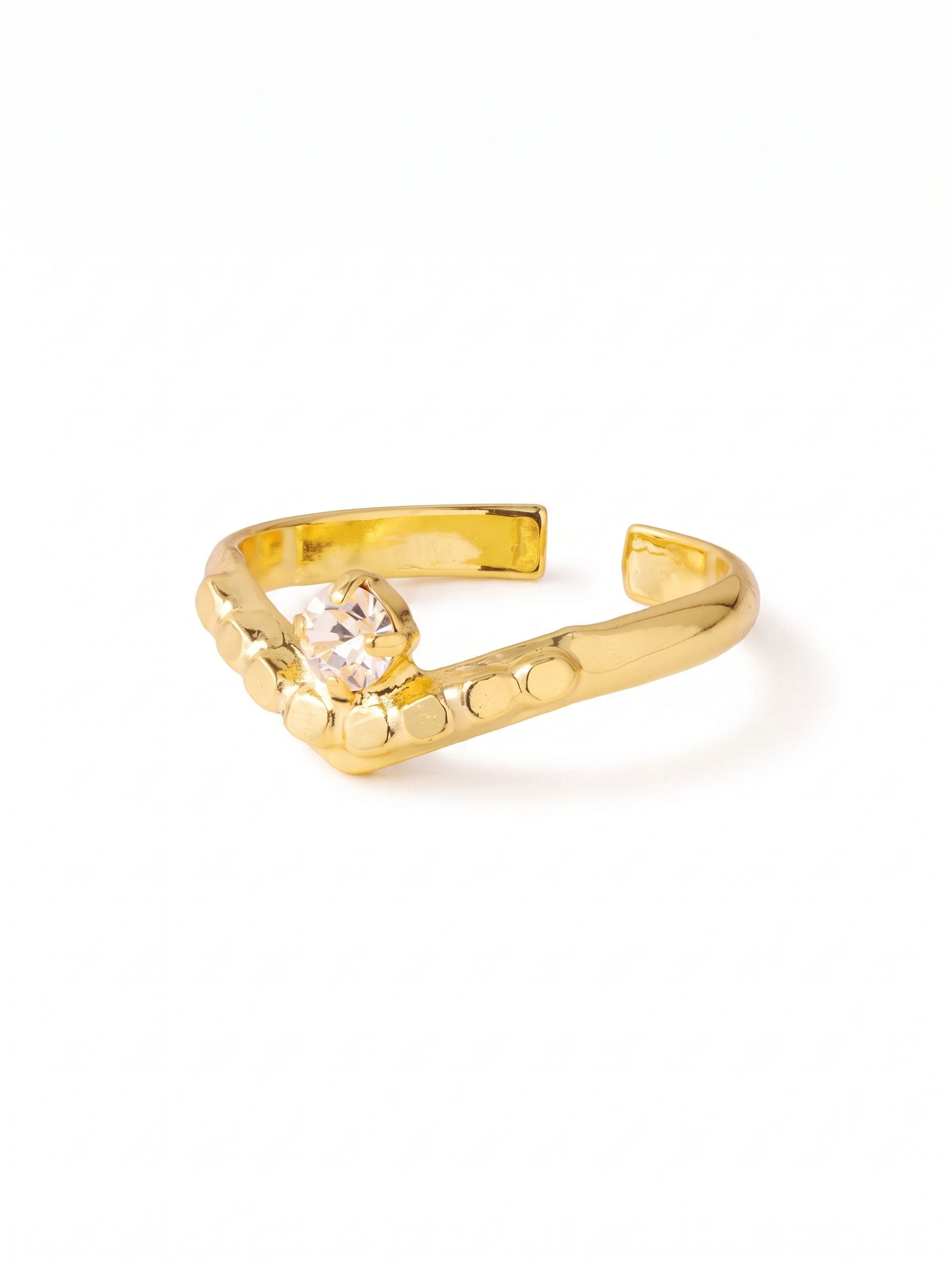 Mika Band Ring - 4RGK1BGCRY - <p>A single round-cut clear crystal provides a crisp focal point against the tactile texture of this ring's ball chain design. Finished in a bright gold-tone, the metallic detailing catches the light naturally with every gesture. The open adjustable band allows you to easily switch fingers or tweak the fit for lasting comfort, making this an effortless piece that adapts to you.</p><ul>
<li>Tactile ball chain construction adds unexpected texture to the band</li>
<li>A solitary clear crystal provides a crisp visual anchor</li>
<li>Adjustable ring band</li>
<li>Protective e-coat finish for lasting wear</li>
<li>Includes signature organza pouch for gifting and travel</li>
</ul>