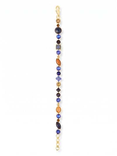 Crystal and Cabochon Tennis Bracelet - BAQ3BGDNM - <p>Deep lapis lazuli and polished sodalite alternate with sharp sapphire and smoked topaz crystals in this textured take on the classic tennis bracelet. The mix of smooth cabochons and faceted stones creates a nuanced line of color that shifts in the light as you move. A slender profile keeps the piece comfortable for daily wear, anchored by an adjustable chain for a precise fit. It is a quiet study in contrast that pairs naturally with your favorite everyday staples.</p><ul>
<li>Alternating opaque cabochons and faceted crystals</li>
<li>Eclectic mix of round, square, and marquise cuts</li>
<li>Lobster claw clasp</li>
<li>3/4-inch adjustable extension chain</li>
<li>Protective e-coat finish for lasting wear</li>
<li>Includes signature organza pouch for gifting and travel</li>
</ul>