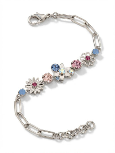 Meadow Tennis Bracelet - BEY130PDPBZ - <p>An airy paperclip chain meets a central cluster of soft pink and pale blue crystals. By gathering round-cut stones and cast metal floral motifs at the center, this piece catches the light distinctly as your wrist turns. The open chain construction keeps the design comfortably lightweight, and an extension link lets you adjust the drape. It offers a subtle wash of pastel color that layers effortlessly next to a silver watch or a solid cuff.</p><ul>
<li>Clustered arrangement of pastel crystals and cast metal floral shapes</li>
<li>Airy paperclip chain construction creating a lightweight feel</li>
<li>Lobster claw clasp</li>
<li>3/4-inch adjustable extension chain</li>
<li>Protective e-coat finish for lasting wear</li>
<li>Includes signature organza pouch for gifting and travel</li>
</ul>