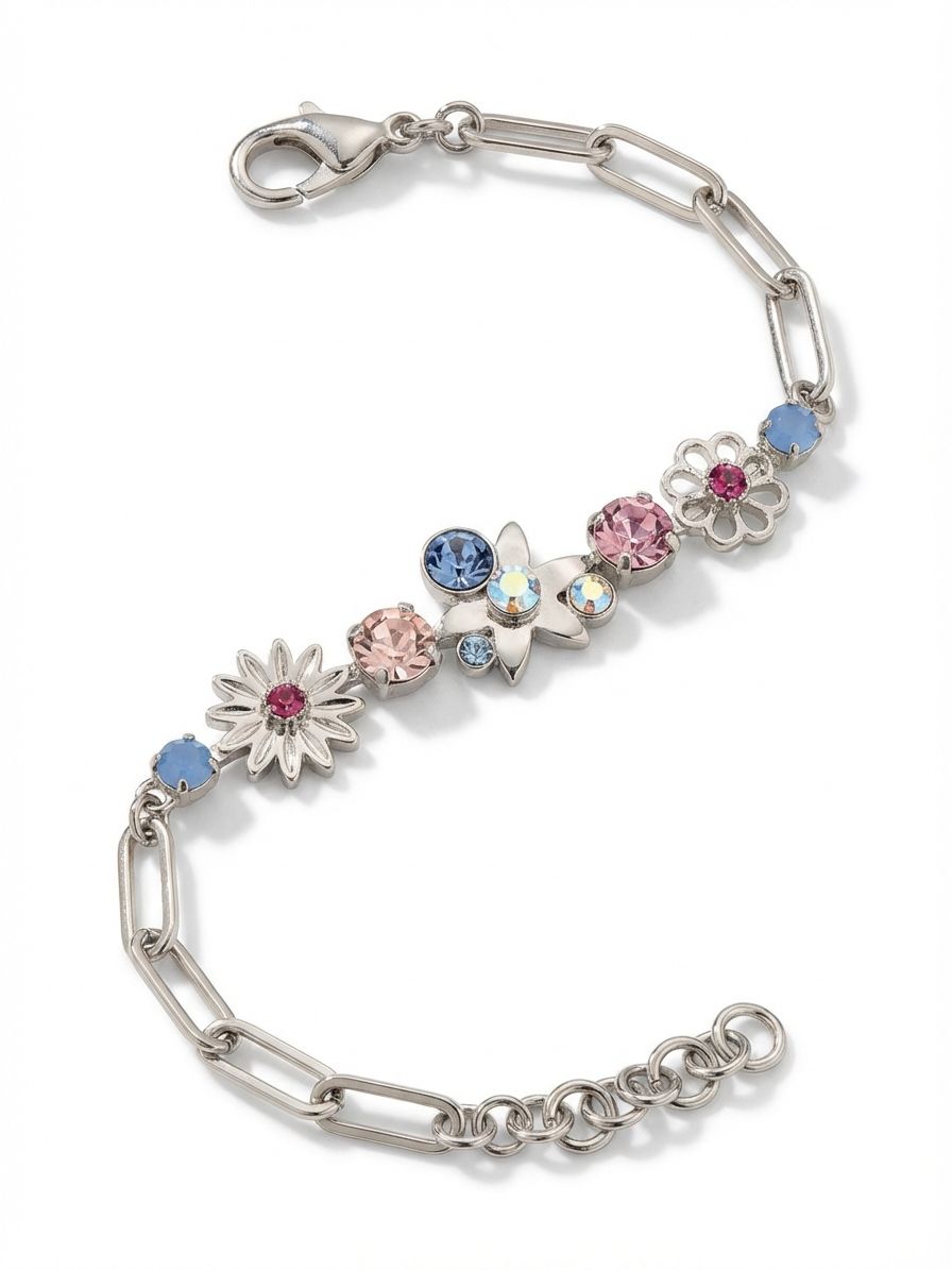 Meadow Tennis Bracelet - BEY130PDPBZ - <p>An airy paperclip chain meets a central cluster of soft pink and pale blue crystals. By gathering round-cut stones and cast metal floral motifs at the center, this piece catches the light distinctly as your wrist turns. The open chain construction keeps the design comfortably lightweight, and an extension link lets you adjust the drape. It offers a subtle wash of pastel color that layers effortlessly next to a silver watch or a solid cuff.</p><ul>
<li>Clustered arrangement of pastel crystals and cast metal floral shapes</li>
<li>Airy paperclip chain construction creating a lightweight feel</li>
<li>Lobster claw clasp</li>
<li>3/4-inch adjustable extension chain</li>
<li>Protective e-coat finish for lasting wear</li>
<li>Includes signature organza pouch for gifting and travel</li>
</ul>