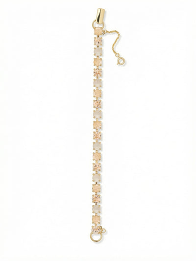 Elsie Tennis Bracelet - BEZ30BGGGO - <p>This tennis bracelet brings a steady ribbon of warm, sunlit color to your daily rotation. Round crystals in soft silk, golden shadow, and iridescent white alternate along a substantial cable chain, catching the light beautifully as your hands move. The fold-over clasp includes a dedicated safety chain, giving you complete confidence when you wear it through busy afternoons or quiet evenings out. It brings a refined, golden goddess warmth to your existing stack without overwhelming your other favorite pieces.</p><ul>
<li>Continuous line of alternating round crystals in warm neutral shades</li>
<li>Set on a substantial cable chain for fluid daily movement</li>
<li>Fold-over clasp with secure safety chain</li>
<li>Protective e-coat finish for lasting wear</li>
<li>Includes signature organza pouch for gifting and travel</li>
</ul>
