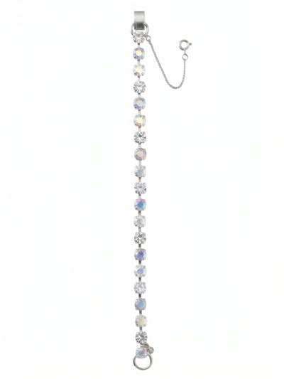 Elsie Tennis Bracelet - BEZ30PDRQ - <p>An unbroken line of light follows every movement of your hand. Round-cut stones shift between crisp clarity, subtle blue opal tones, and the iridescent flash of Aurora Borealis. The flexible channel chain keeps the crystals carefully aligned, offering a fluid drape that moves naturally as you type, reach, and go about your day. Designed with an adjustable extension chain, the bracelet lets you find your exact preferred fit, bringing a constant, quiet polish to your daily routine.</p><ul>
<li>Flexible channel chain construction keeps crystals aligned in motion</li>
<li>Alternating clear and iridescent stones create a subtly shifting color profile</li>
<li>Fold-over clasp</li>
<li>Protective e-coat finish for lasting wear</li>
<li>Includes signature organza pouch for gifting and travel</li>
</ul>