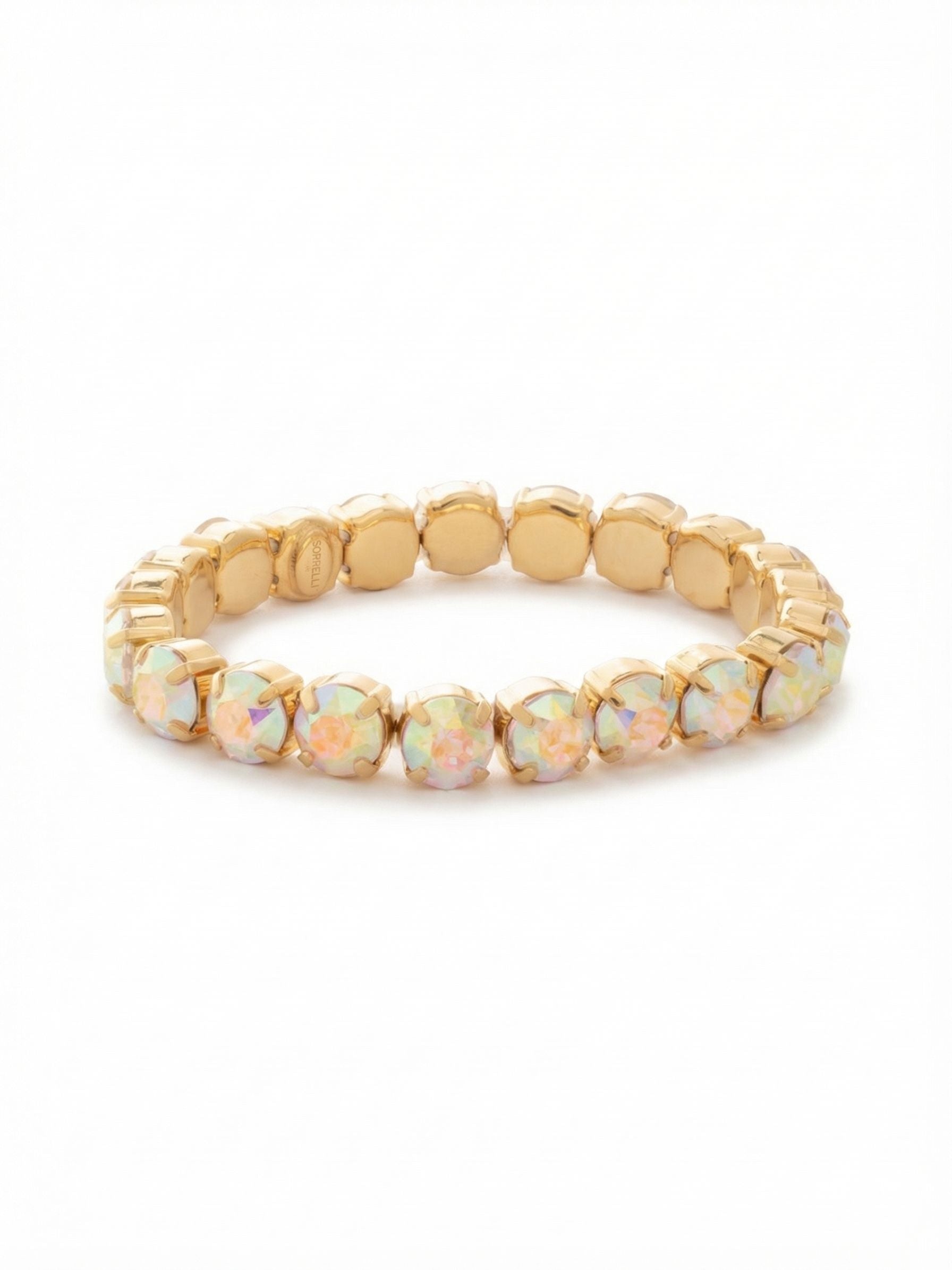 7 inch Sienna Stretch Bracelet - BFD50BGCAB - <p>A continuous band of iridescent round-cut crystals creates an unbroken circle of light. The Aurora Borealis stones shift through a spectrum of pastels as you move, framed by warm gold-tone settings. The hidden stretch cord means it slips on effortlessly over the hand, maintaining a seamless visual line without the interruption of a clasp. It offers a substantial presence whether worn as a solo pop of color or woven into your daily stack.</p><ul>
<li>Continuous band of chunky round-cut crystals</li>
<li>Iridescent stones shift color from every angle</li>
<li>Stretch easy slip-on design</li>
<li>Protective e-coat finish for lasting wear</li>
<li>Includes signature organza pouch for gifting and travel</li>
</ul>