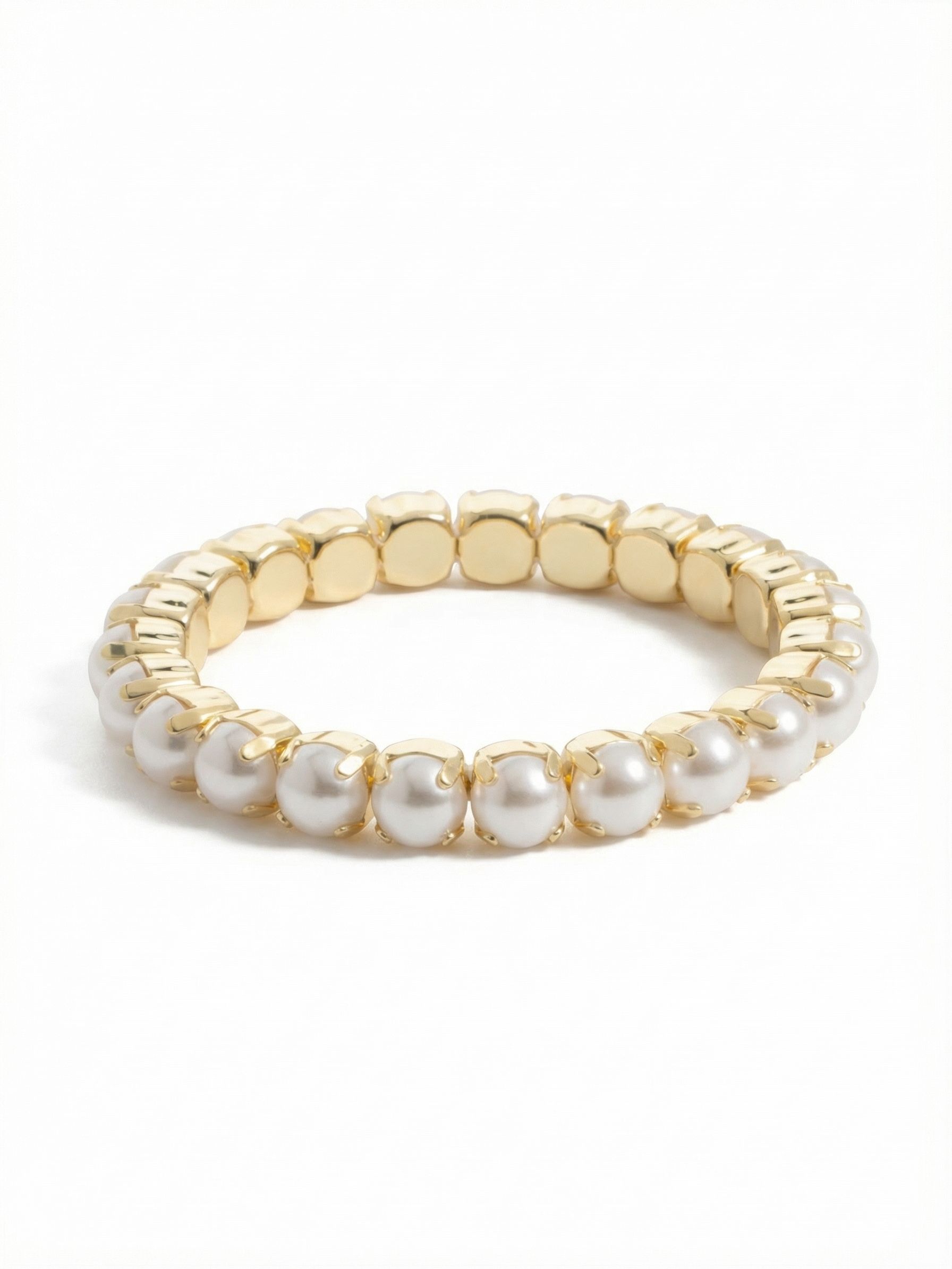 7 inch Sienna Stretch Bracelet - BFD50BGMDP - <p>A continuous loop of snow white pearls offers an immediate sense of polish to your daily routine. The stretch design glides onto your hand without the fuss of clasps, becoming an effortless addition when you are heading out the door. Solid gold-tone prongs cup each eight millimeter pearl, giving the soft spheres a defined, architectural edge. It anchors a stack alongside your favorite watch or stands out quietly on its own.</p><ul>
<li>Continuous stretch loop for easy daily wear</li>
<li>Soft round pearls framed by architectural prongs</li>
<li>Stretch easy slip-on design</li>
<li>Protective e-coat finish for lasting wear</li>
<li>Includes signature organza pouch for gifting and travel</li>
</ul>