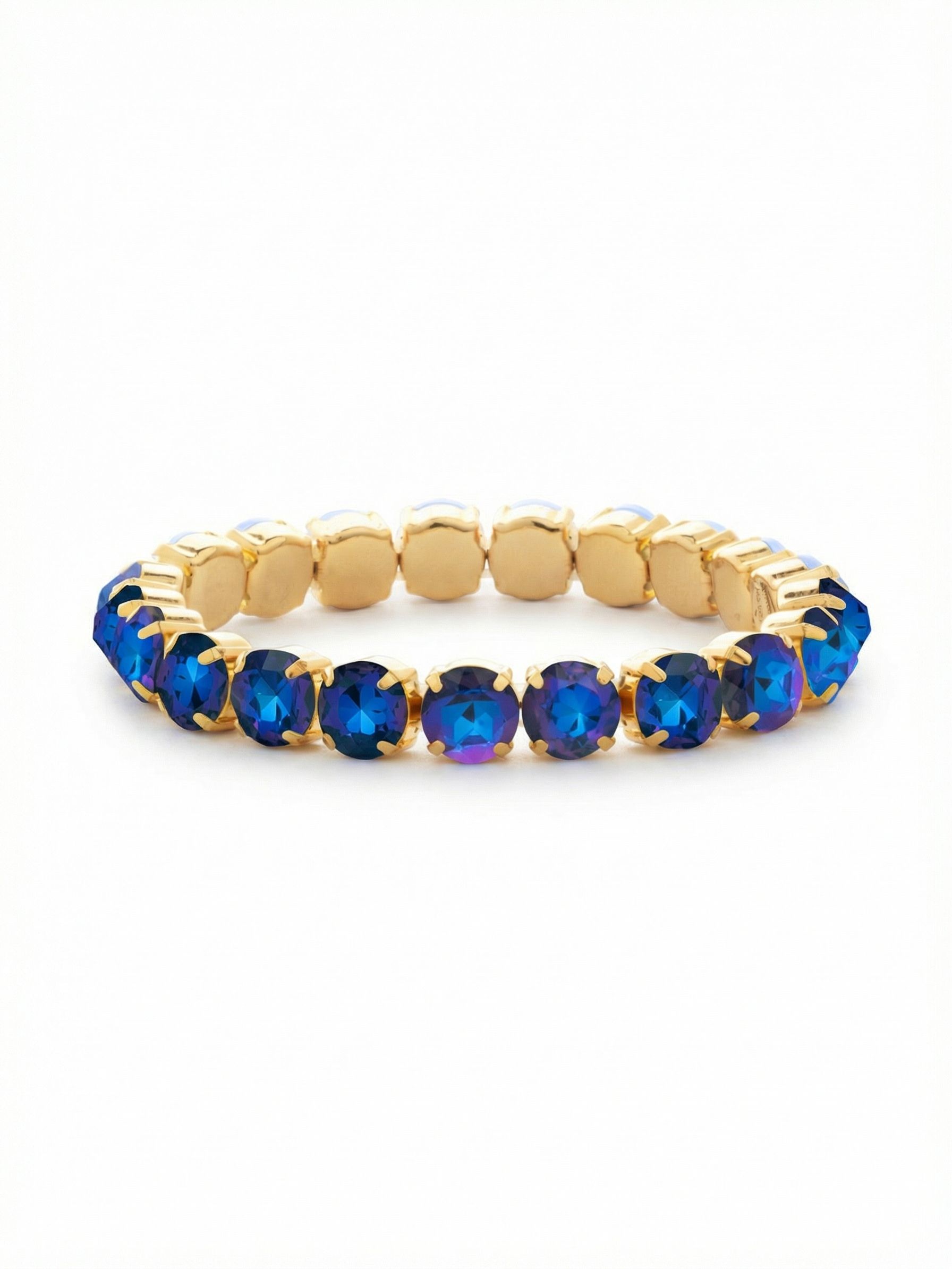 7 inch Sienna Stretch Bracelet - BFD50BGRBD - <p>An unbroken circle of vivid Royal Blue Delite crystals encircles the arm, delivering deep color with subtle violet shifts in the light. The substantial round stones bring noticeable weight and presence to an otherwise effortless stretch design. Slip it on to add a bright gold-tone accent next to your daily watch, or let it anchor a growing stack. The flexible construction yields easily to your movements, completely eliminating the need to navigate a tiny metal clasp.</p><ul>
<li>Uniform round stones offer consistent color and scale from every angle</li>
<li>Flexible stretch core allows for effortless styling without breaking the visual line</li>
<li>Stretch easy slip-on design</li>
<li>Protective e-coat finish for lasting wear</li>
<li>Includes signature organza pouch for gifting and travel</li>
</ul>