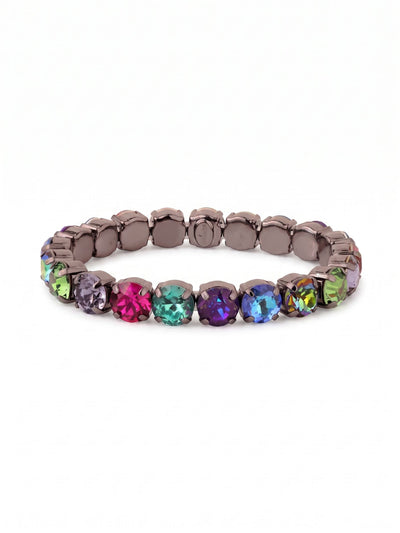 7 inch Sienna Stretch Bracelet - BFD50GMNNI - <p>A rich spectrum of round-cut crystals circles the wrist in an unbroken ring of deep jewel tones. The stretch design allows you to roll this piece effortlessly over your hand, skipping the fuss of a clasp entirely. Set in dark metal, the vibrant fuchsia, deep tanzanite, and vivid emerald hues catch the light with every gesture. It holds enough presence to anchor a stack, yet feels substantial and complete worn all on its own.</p><ul>
<li>Repeating sequence of large round-cut crystals in a vibrant jewel-toned palette</li>
<li>Unbroken circular design offering high visual impact from every angle</li>
<li>Stretch easy slip-on design</li>
<li>Includes signature organza pouch for gifting and travel</li>
</ul>