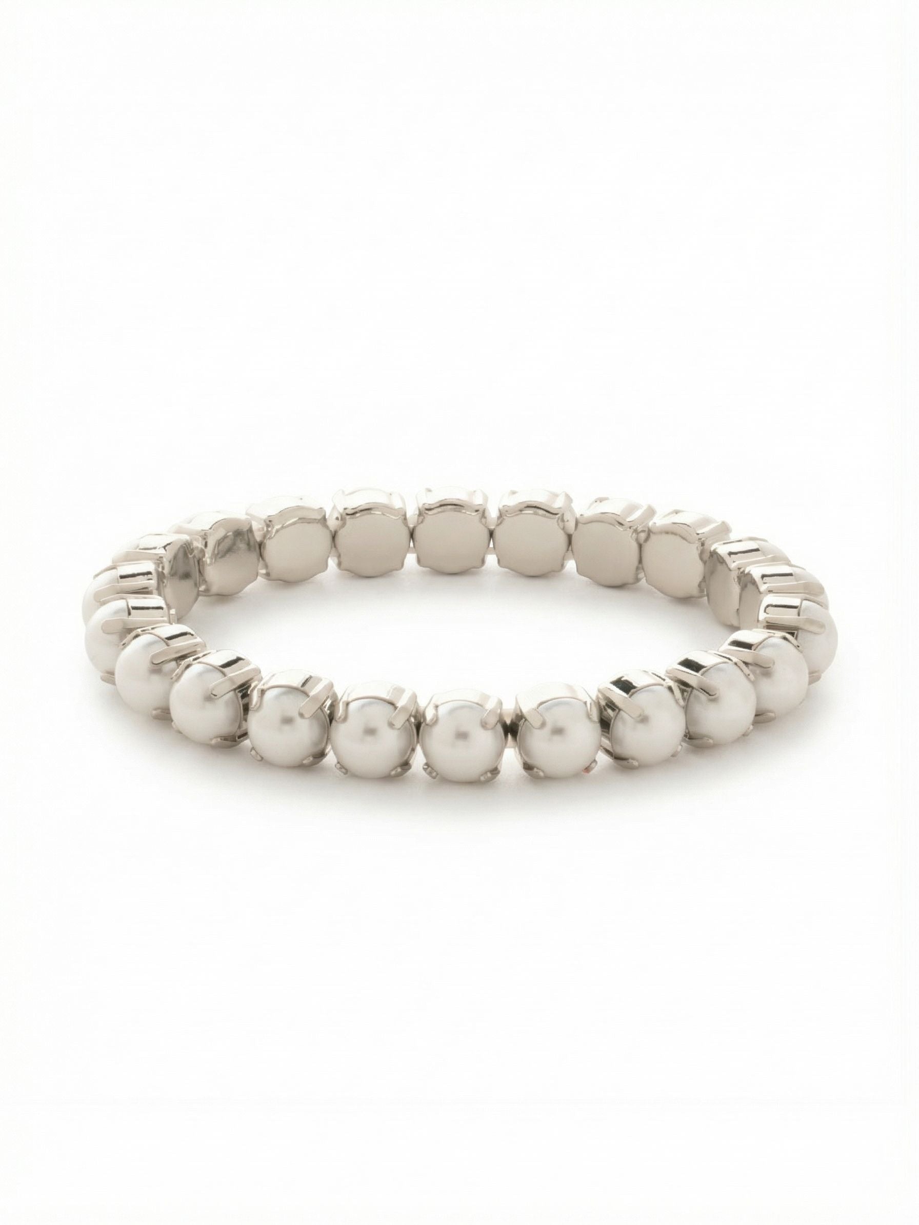 7 inch Sienna Stretch Bracelet - BFD50PDMDP - <p>A continuous loop of luminous snow white pearls brings a modern polish to an everyday stack. The stretch construction means you can simply roll it over your hand when rushing out the door, completely bypassing the frustration of one-handed clasps. Each eight-millimeter pearl is secured in a quiet prong setting that adds subtle metallic texture to the continuous line. It carries enough visual weight to stand alone on your arm while mixing easily with silver chains or a favorite watch.</p><ul>
<li>Continuous loop of uniform eight-millimeter pearls</li>
<li>Visible prong settings add structural texture to the classic round pearls</li>
<li>Stretch easy slip-on design</li>
<li>Protective e-coat finish for lasting wear</li>
<li>Includes signature organza pouch for gifting and travel</li>
</ul>