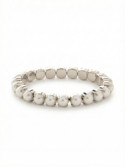 7 inch Sienna Stretch Bracelet - BFD50PDMDP - <p>A continuous loop of luminous snow white pearls brings a modern polish to an everyday stack. The stretch construction means you can simply roll it over your hand when rushing out the door, completely bypassing the frustration of one-handed clasps. Each eight-millimeter pearl is secured in a quiet prong setting that adds subtle metallic texture to the continuous line. It carries enough visual weight to stand alone on your arm while mixing easily with silver chains or a favorite watch.</p><ul>
<li>Continuous loop of uniform eight-millimeter pearls</li>
<li>Visible prong settings add structural texture to the classic round pearls</li>
<li>Stretch easy slip-on design</li>
<li>Protective e-coat finish for lasting wear</li>
<li>Includes signature organza pouch for gifting and travel</li>
</ul>