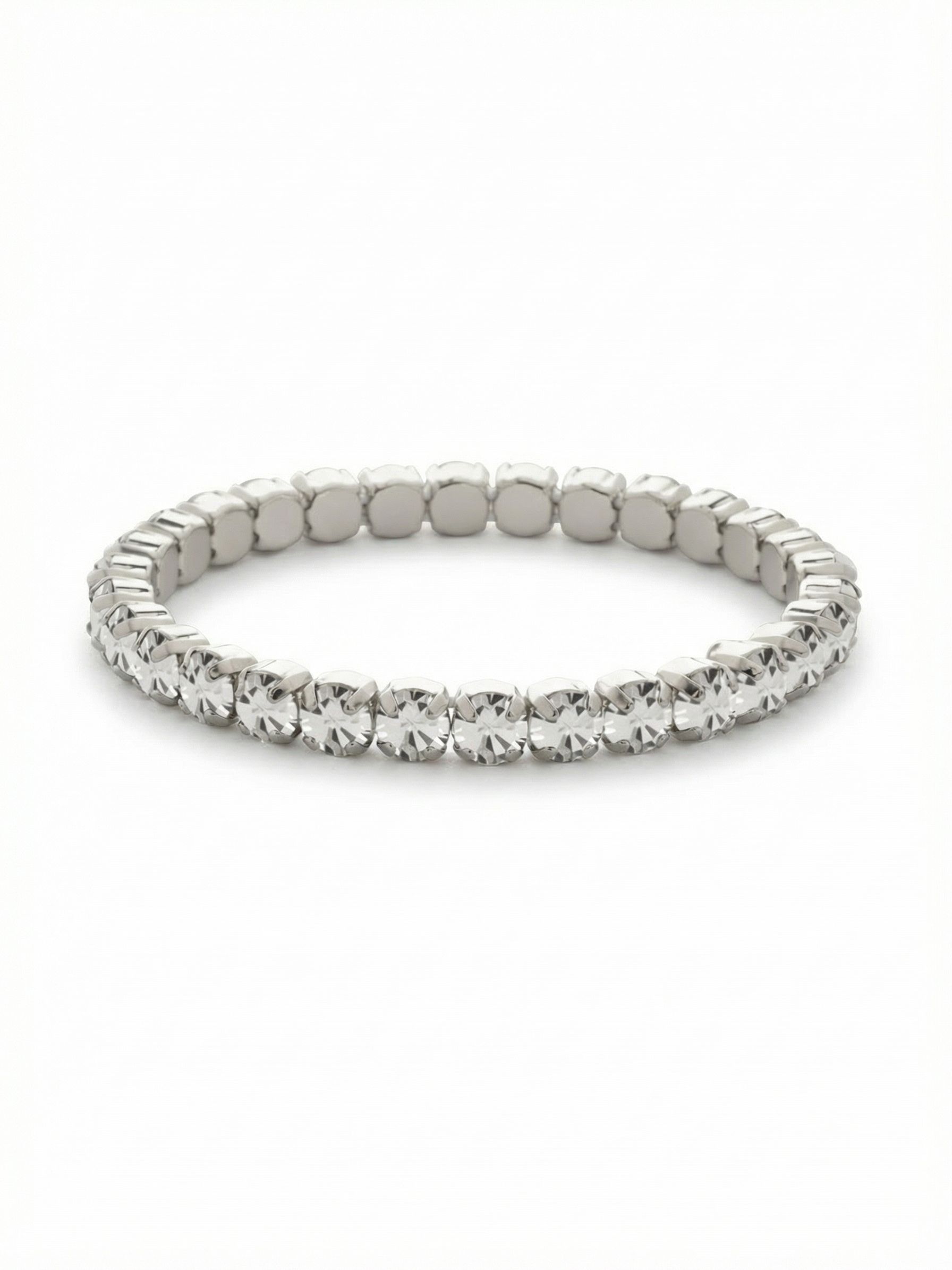 Mini Sienna Stretch Bracelet - BFD52PDCRY - <p>A seamless circle of clear round-cut crystals, this stretch bracelet brings the continuous sparkle of a classic line design without the fuss of a clasp. The hidden elasticity allows it to slip easily over your hand, settling comfortably along the wrist bone. Worn alone, the cool palladium setting frames each stone to catch the light with every gesture. It also makes an effortless foundational piece to build out a structured daily stack.</p><ul>
<li>Unbroken line of brilliant round-cut crystals</li>
<li>Concealed stretch core for a seamless circular silhouette</li>
<li>Stretch easy slip-on design</li>
<li>Protective e-coat finish for lasting wear</li>
<li>Includes signature organza pouch for gifting and travel</li>
</ul>