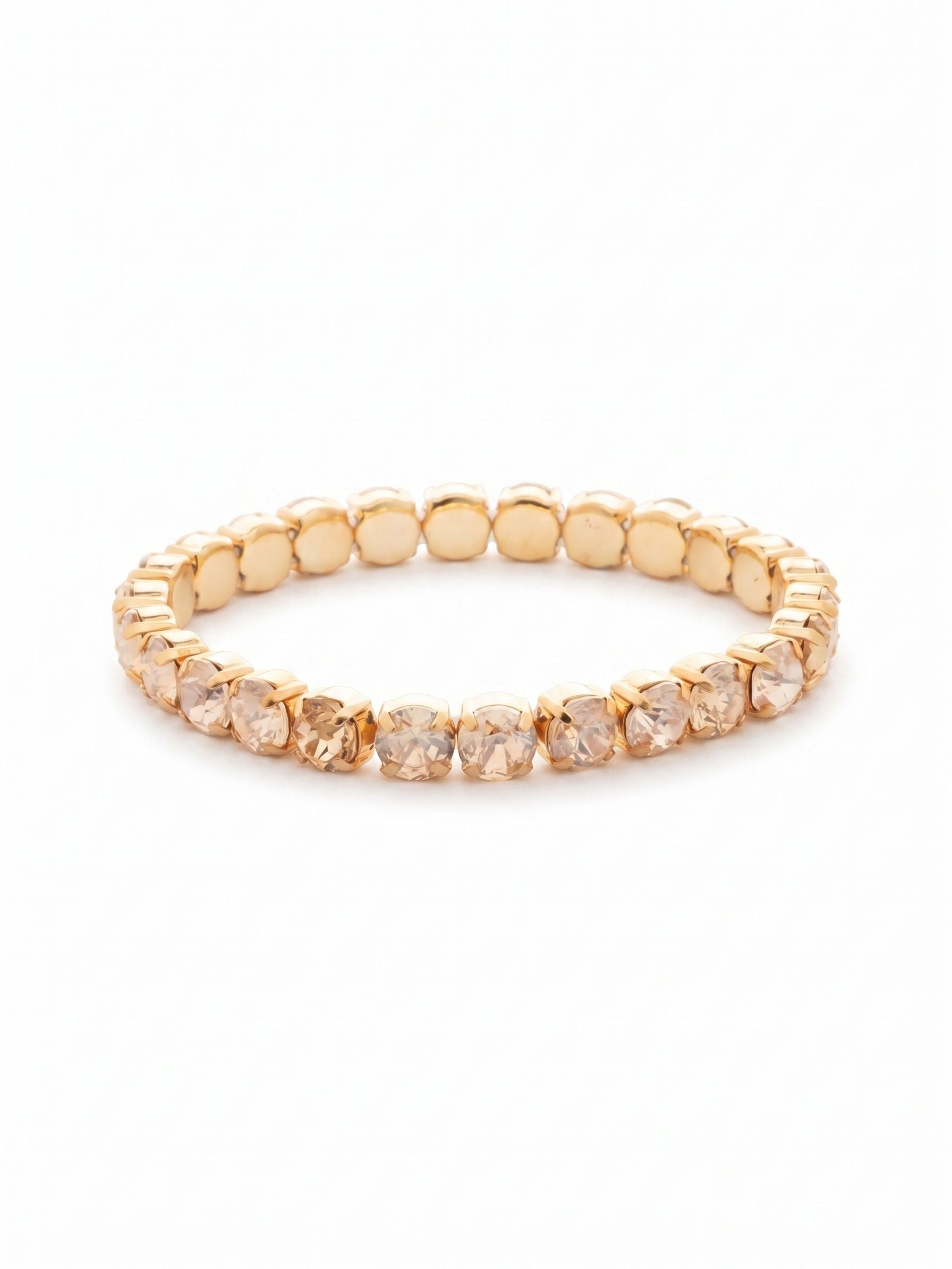 8 inch Sienna Stretch Bracelet - BFD60BGDCH - <p>A modern take on a classic style, the Sienna Stretch Bracelet features a line of crystals on a sturdy jewelers' filament, stretching to fit most wrists comfortably, without the hassle of a clasp! (8 inches in diameter, fits larger wrist sizes) From Sorrelli's Dark Champagne collection in our Bright Gold-tone finish.</p>