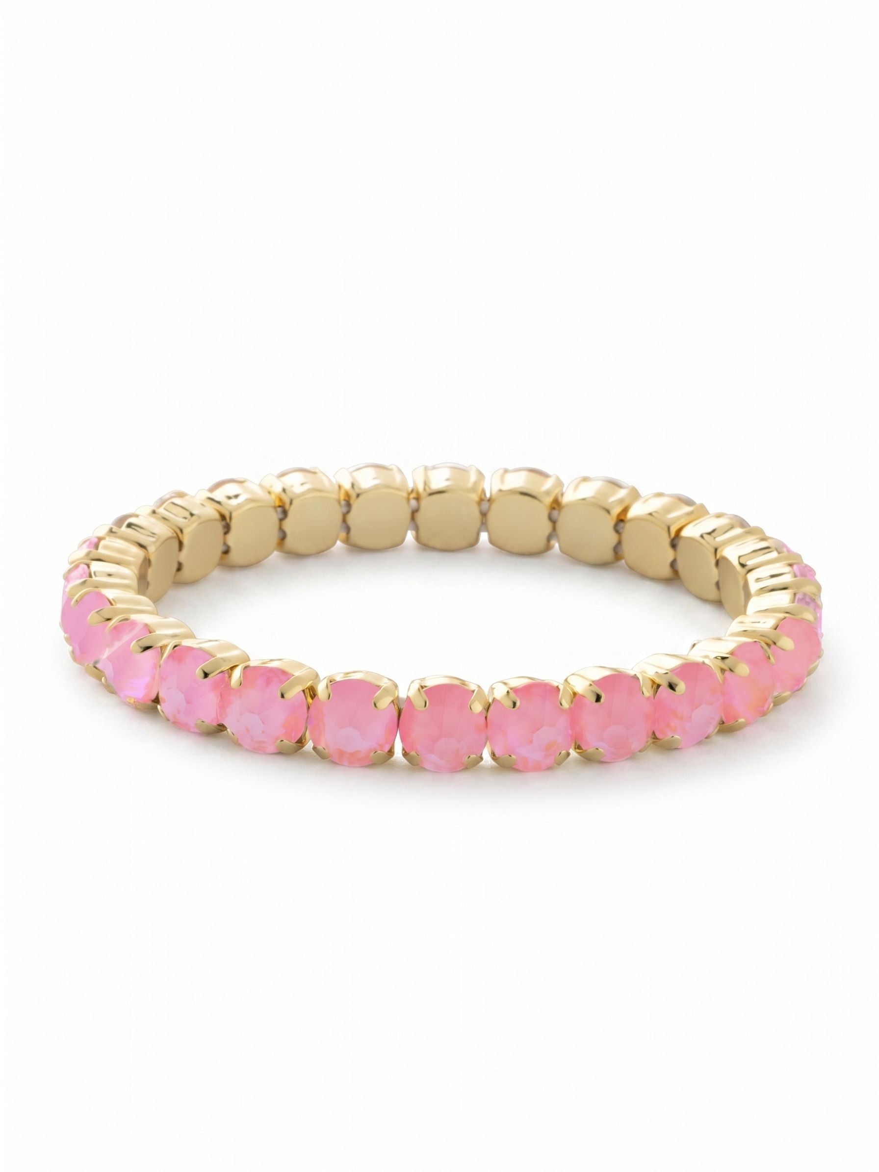 8 inch Sienna Stretch Bracelet - BFD60BGLRD - <p>An effortless addition to your daily routine. This stretch bracelet offers a continuous row of round pink crystals that slide comfortably over your hand without the need to navigate a clasp. The warm gold-tone settings frame each stone tightly, creating an unbroken band of soft color that flexes easily as you move. It layers naturally with your favorite chain bracelets or stands alone as a quiet focal point on the wrist.</p><ul>
<li>Continuous row of round-cut crystals creates an unbroken band of color</li>
<li>Flexible, clasp-free design slides easily over the hand</li>
<li>Stretch easy slip-on design</li>
<li>Protective e-coat finish for lasting wear</li>
<li>Includes signature organza pouch for gifting and travel</li>
</ul>