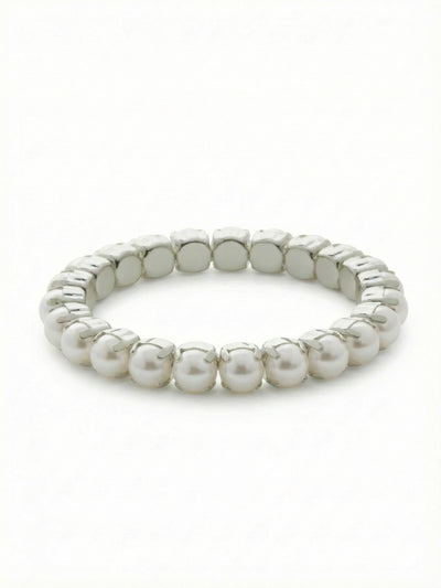 8 inch Sienna Stretch Bracelet - BFD60PDMDP - <p>A continuous row of snow white pearls is individually set in polished metal cups, creating an unbroken line of soft luster that wraps around your wrist. The flexible stretch construction means there are no clasps to fuss with when you are getting dressed. It carries a satisfying weight that feels substantial when worn alone, yet it slides easily into a stack of your favorite daily bracelets.</p><ul>
<li>Unbroken row of uniformly sized pearls creates a clean visual rhythm</li>
<li>Individual prong settings give an architectural feel to a classic material</li>
<li>Stretch easy slip-on design</li>
<li>Protective e-coat finish for lasting wear</li>
<li>Includes signature organza pouch for gifting and travel</li>
</ul>
