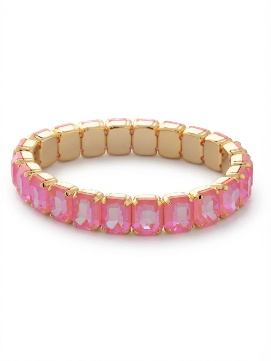 7 inch Octavia Stretch Bracelet - BFM30BGBFL - <p>A continuous band of architectural color, this stretch design encircles the arm with substantial emerald-cut crystals. The stepped facets of the large stones catch light with clean precision, contrasting warmly against the gold-tone settings. With no clasp to maneuver, it slides effortlessly over the hand to provide a close fit that adapts to your movement. It carries enough weight and color to wear solo as the anchor point for a casual sleeve, while the sleek rectangular profile makes it an easy addition to an everyday stack.</p><ul>
<li>Continuous line of substantial emerald-cut stones</li>
<li>Stepped rectangular facets create a bold architectural profile</li>
<li>Stretch easy slip-on design</li>
<li>Protective e-coat finish for lasting wear</li>
<li>Includes signature organza pouch for gifting and travel</li>
</ul>