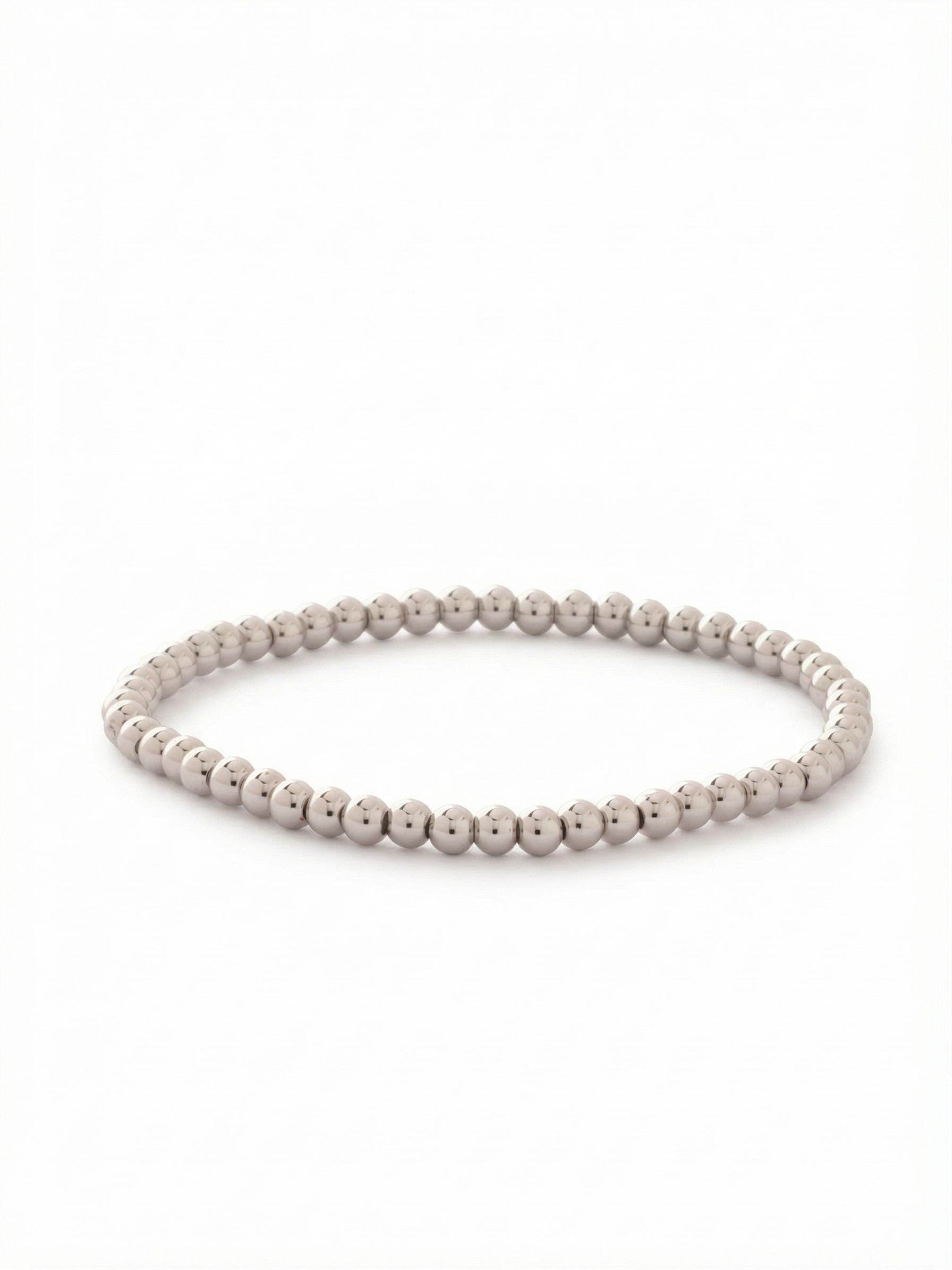Mini Zola Stretch Bracelet - BFN20PDMTL - <p>A continuous loop of polished metal spheres, this slim piece brings quiet, reflective texture to your daily stack. The stretch construction rolls effortlessly over your hand and moves naturally with your arm. Crafted entirely from highly reflective beads, it catches ambient light with a subtle liquid metal effect. It works seamlessly as a minimalist standalone layer or stacked deep alongside heavier cuffs and crystal chains.</p><ul>
<li>Continuous loop of highly polished metallic spheres</li>
<li>Slim profile designed for seamless stacking</li>
<li>Stretch easy slip-on design</li>
<li>Protective e-coat finish for lasting wear</li>
<li>Includes signature organza pouch for gifting and travel</li>
</ul>