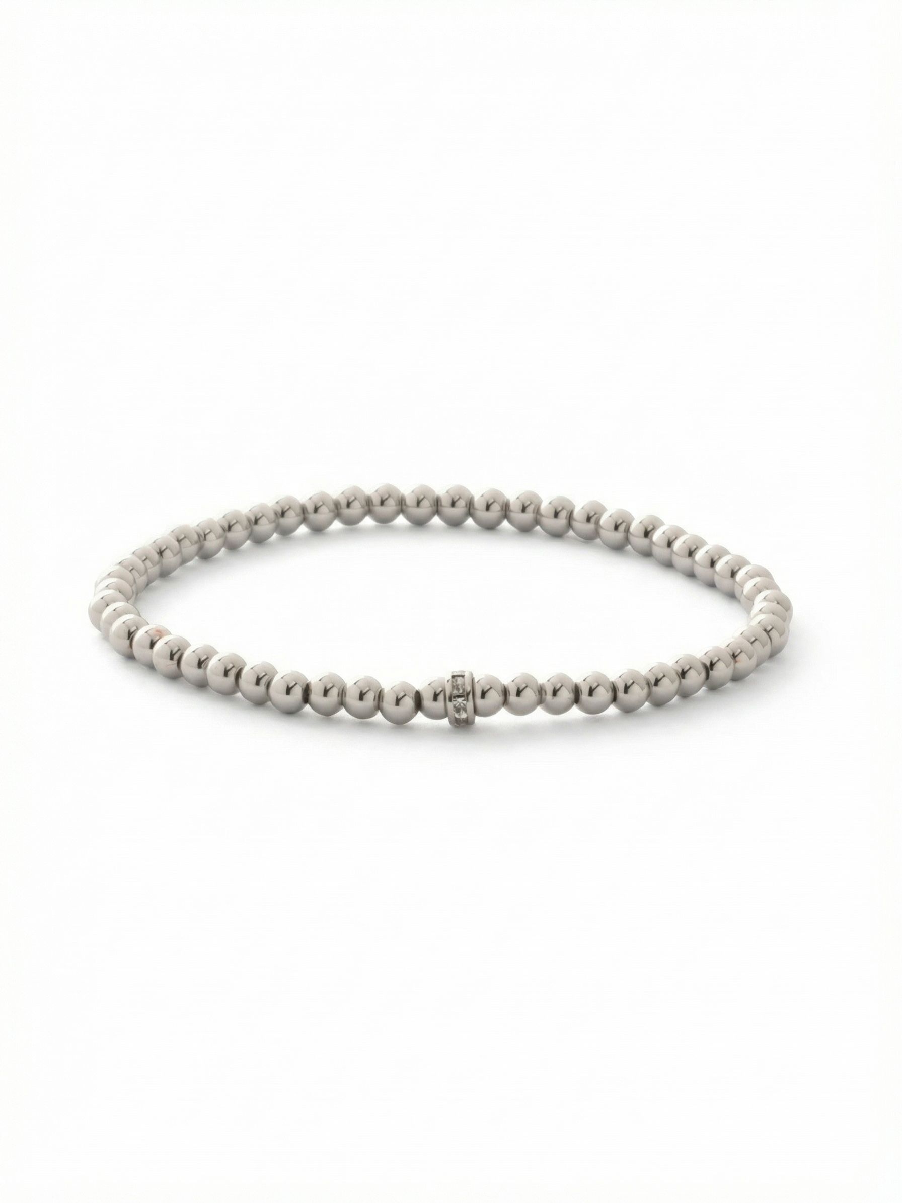 Mini Zola Charm Stretch Bracelet - BFN31PDCRY - <p>A smooth line of cool metallic beads rolls effortlessly onto the wrist, offering instant polish without the fuss of a clasp. The continuous stretch design adapts to your movements, making it an easy foundation for daily wear. A single crystal-studded accent ring anchors the sleek palladium tone, catching the light just enough to hold its own solo or add quiet texture to a layered stack of your favorite bracelets.</p><ul>
<li>Continuous strand of smooth metallic beads</li>
<li>Single crystal-studded accent ring adds subtle texture</li>
<li>Stretch easy slip-on design</li>
<li>Protective e-coat finish for lasting wear</li>
<li>Includes signature organza pouch for gifting and travel</li>
</ul>
