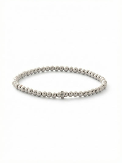 Mini Zola Charm Stretch Bracelet - BFN31PDCRY - <p>A smooth line of cool metallic beads rolls effortlessly onto the wrist, offering instant polish without the fuss of a clasp. The continuous stretch design adapts to your movements, making it an easy foundation for daily wear. A single crystal-studded accent ring anchors the sleek palladium tone, catching the light just enough to hold its own solo or add quiet texture to a layered stack of your favorite bracelets.</p><ul>
<li>Continuous strand of smooth metallic beads</li>
<li>Single crystal-studded accent ring adds subtle texture</li>
<li>Stretch easy slip-on design</li>
<li>Protective e-coat finish for lasting wear</li>
<li>Includes signature organza pouch for gifting and travel</li>
</ul>