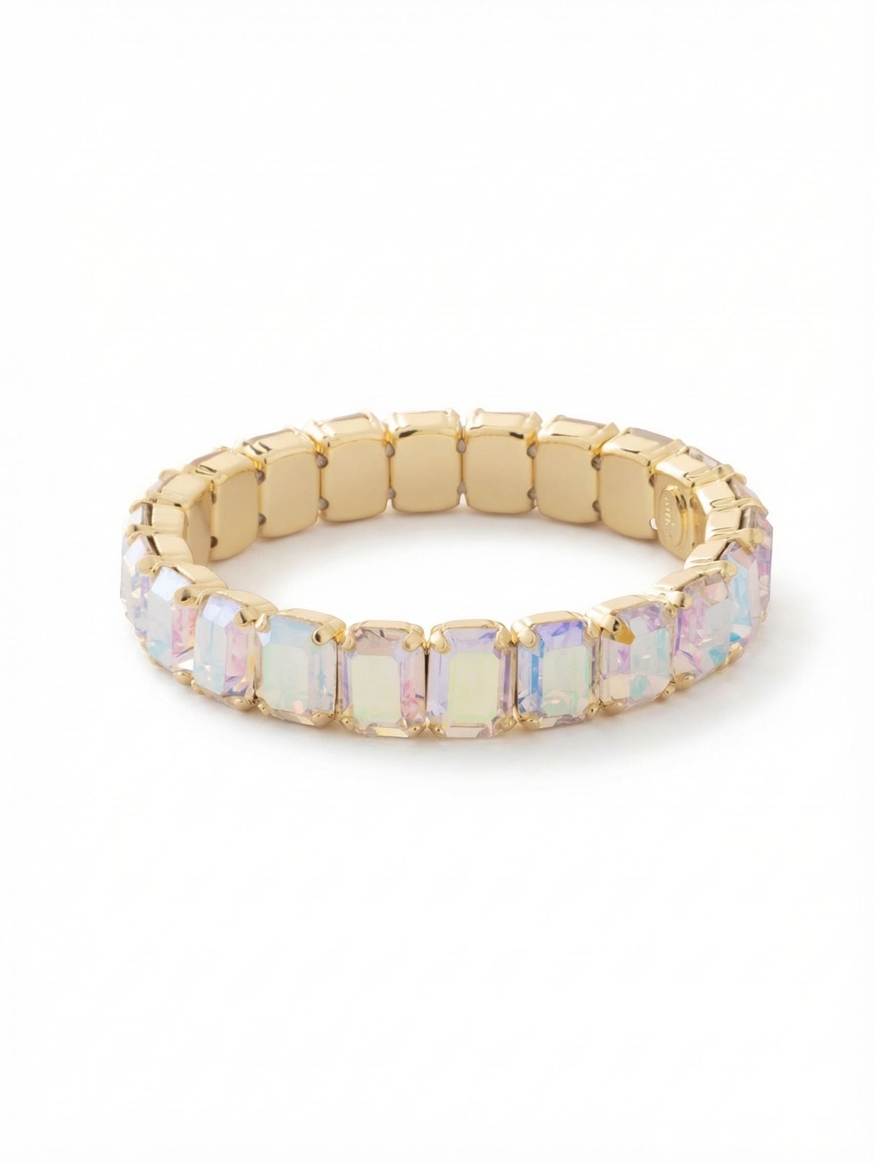 8 inch Octavia Stretch Bracelet - BFS17BGCAB - <p>A continuous band of emerald-cut crystals creates an unbroken line of iridescent light around the wrist. The Aurora Borealis stones throw subtle flashes of pale pink and blue with every movement, catching the eye naturally. Designed with a flexible interior, this piece slides on effortlessly without the fuss of a clasp. At a half-inch wide, it offers enough structural presence to anchor a mixed stack, yet holds its own when worn as a singular statement.</p><ul>
<li>Continuous sequence of emerald-cut crystals</li>
<li>Half-inch width provides structural presence</li>
<li>Stretch easy slip-on design</li>
<li>Protective e-coat finish for lasting wear</li>
<li>Includes signature organza pouch for gifting and travel</li>
</ul>